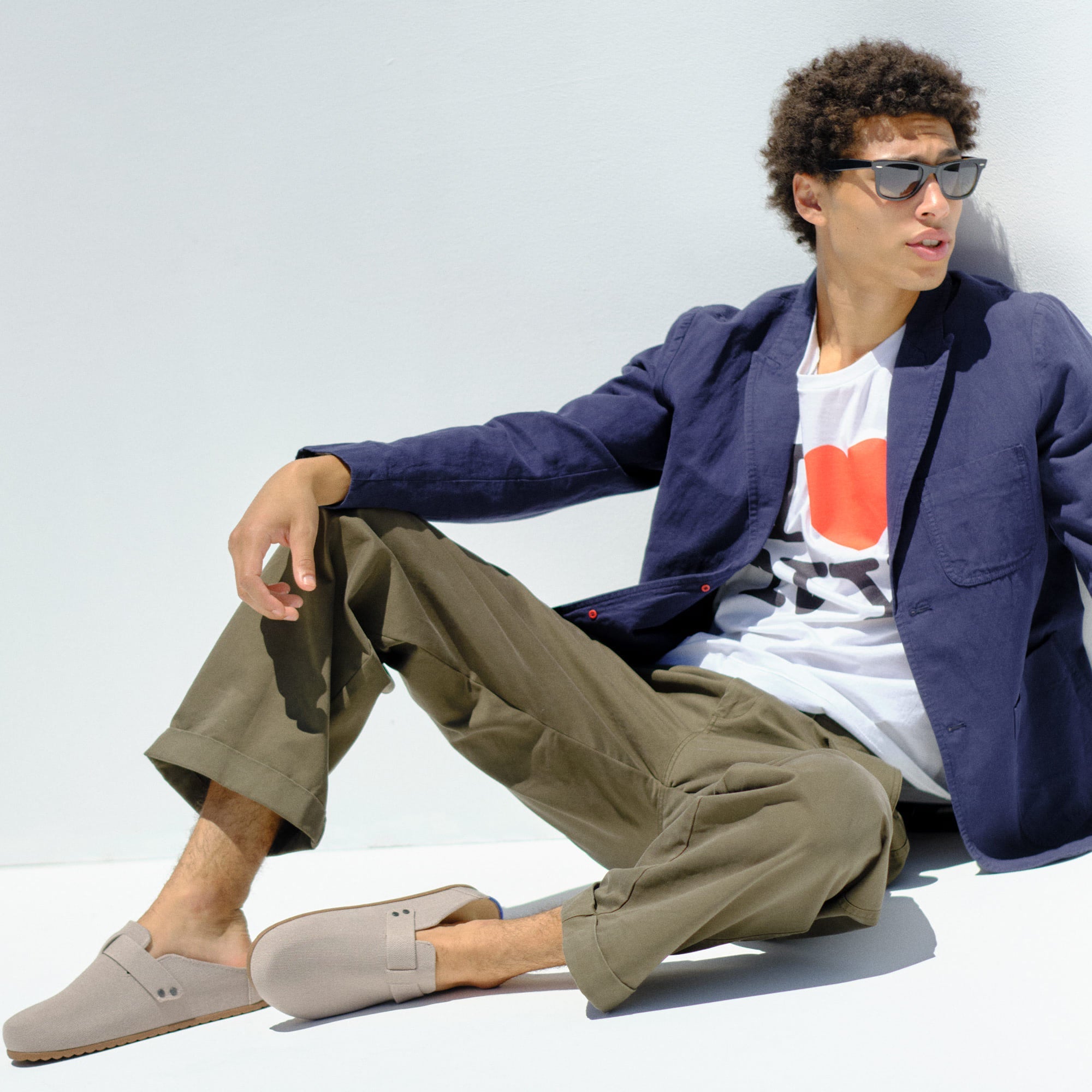 hover | Model wearing The Men's Clog in Dove.