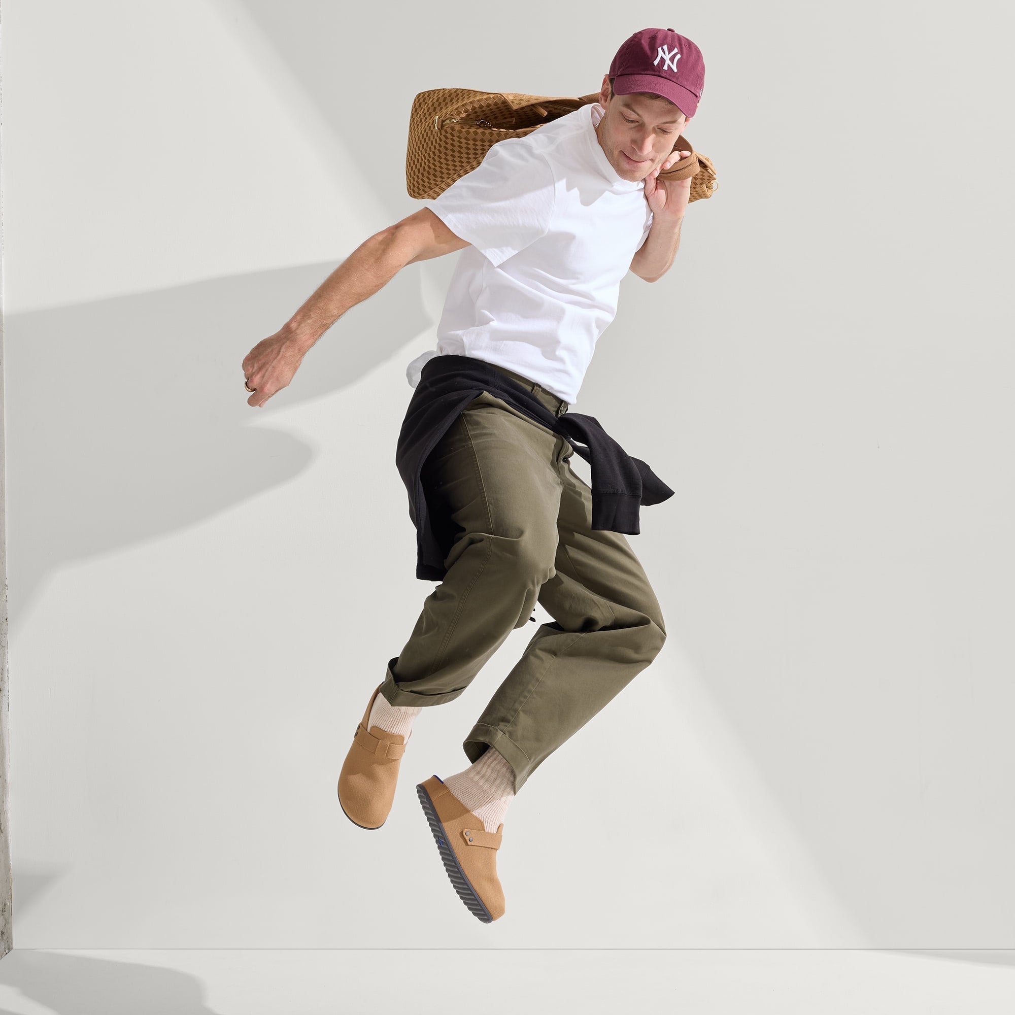 Alternate view of a model wearing The Men's Clog in Butternut.