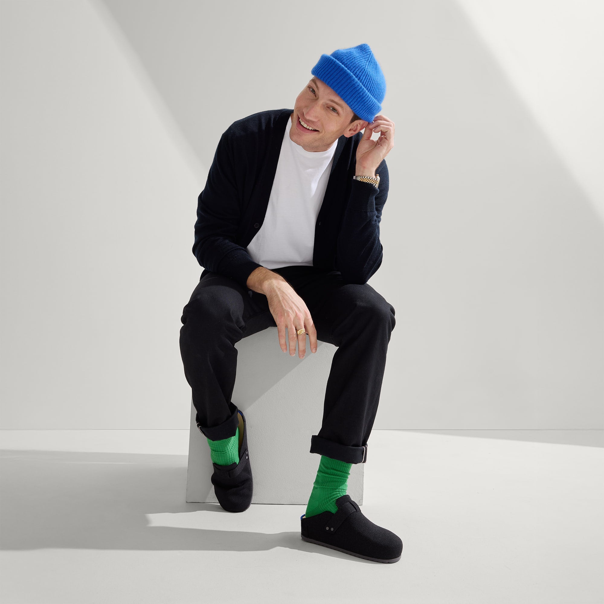 Alternate view of a model wearing The Men's Clog in Soft Black.