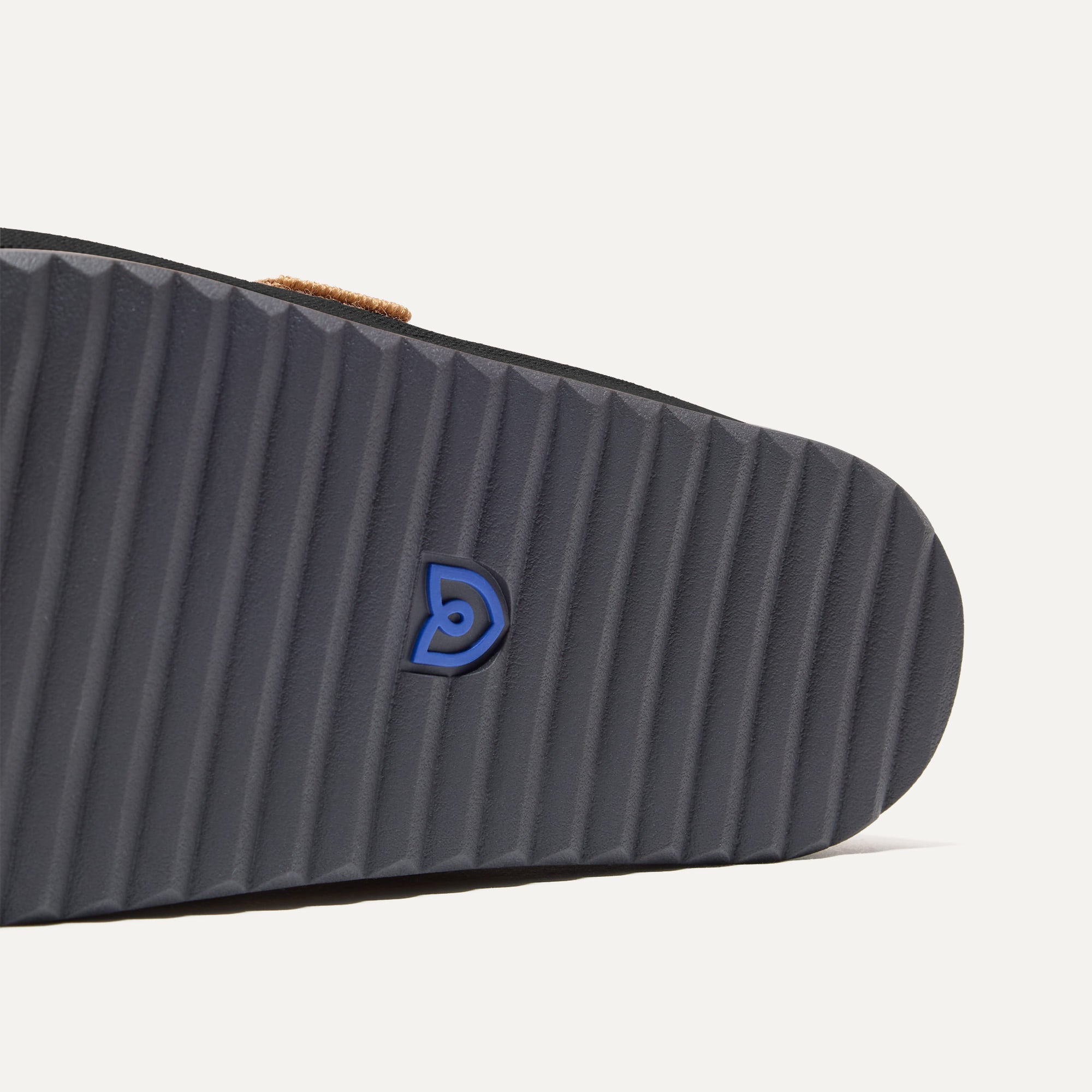 Close up of the outsoles of The Men's Clog in Soft Black.