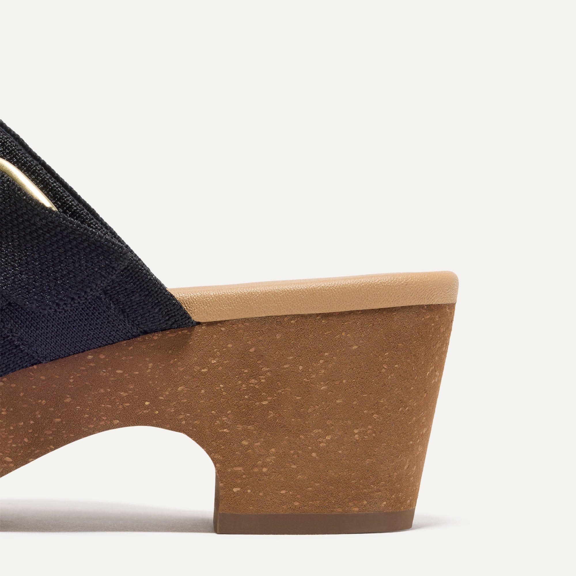 Close up of the heel of The Classic Clog in Black shown from the side.