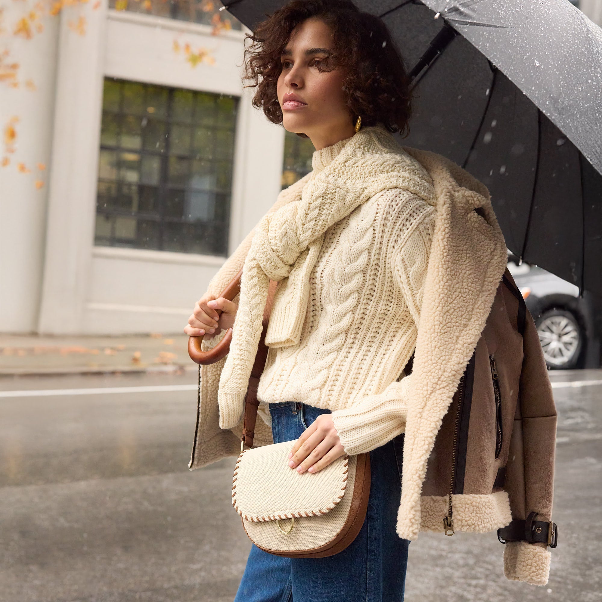 hover | The Saddle Bag in Flat White shown held by a model.