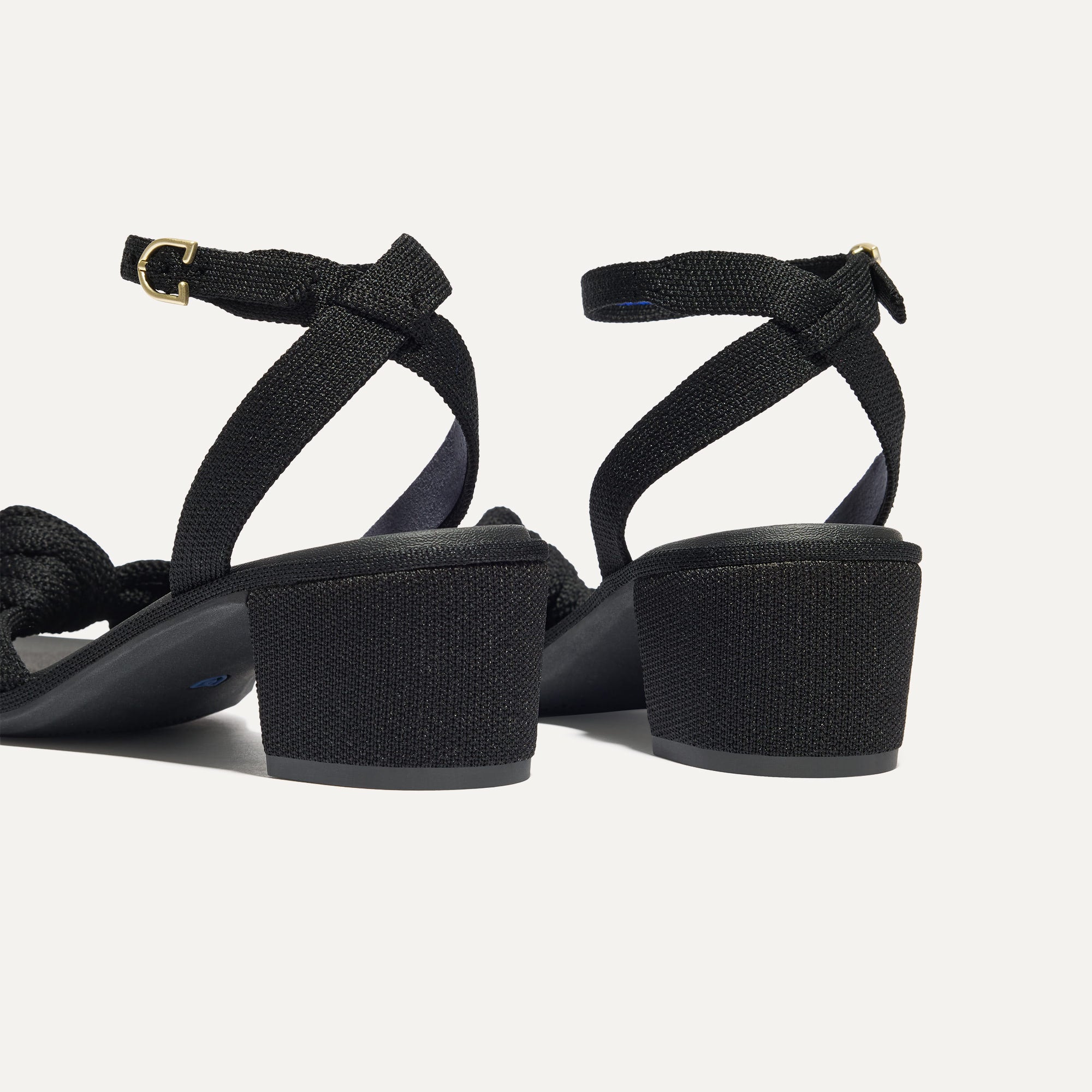 Close up of the heel of The Knot Sandal in Black.