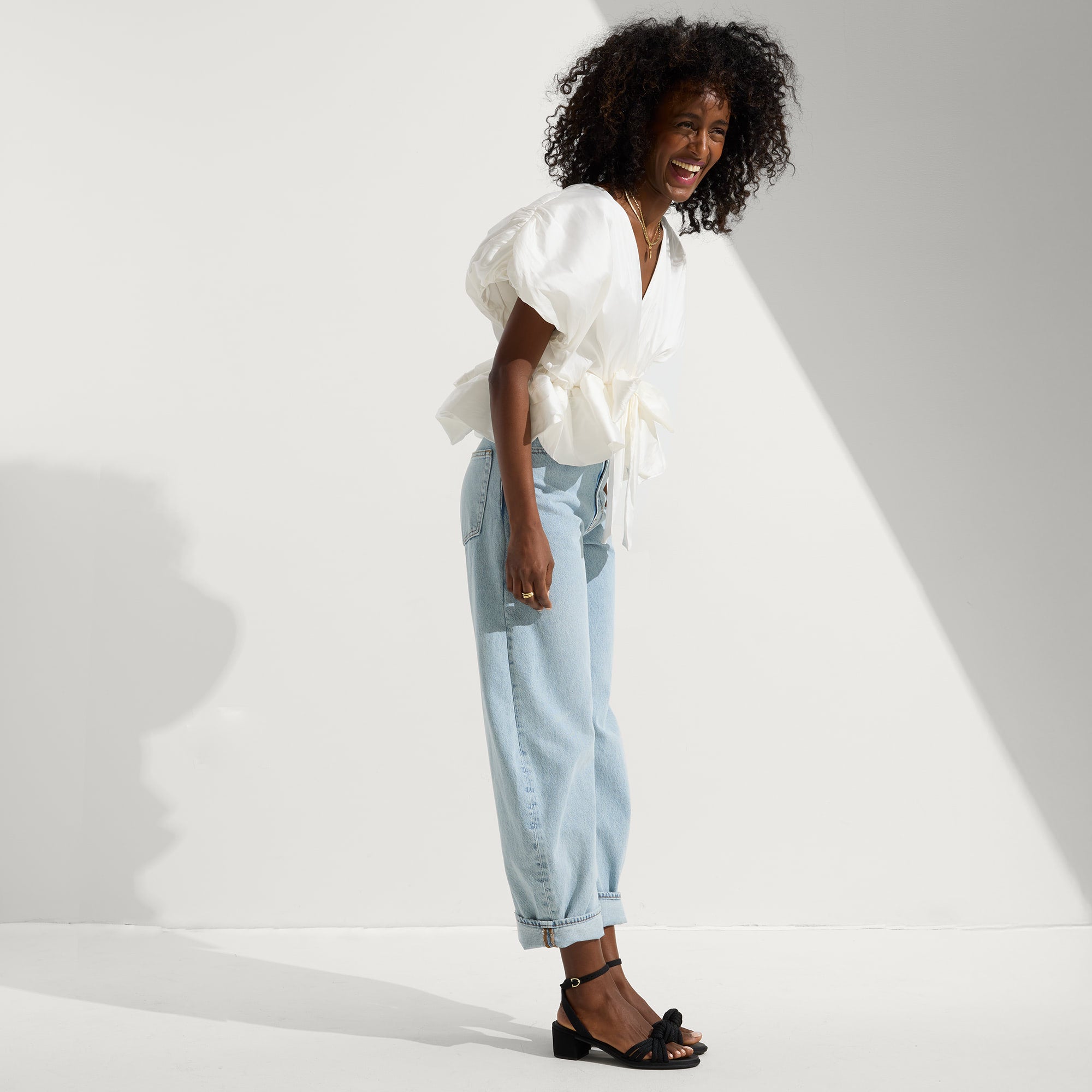 Alternate view of a model wearing The Knot Sandal in Black.