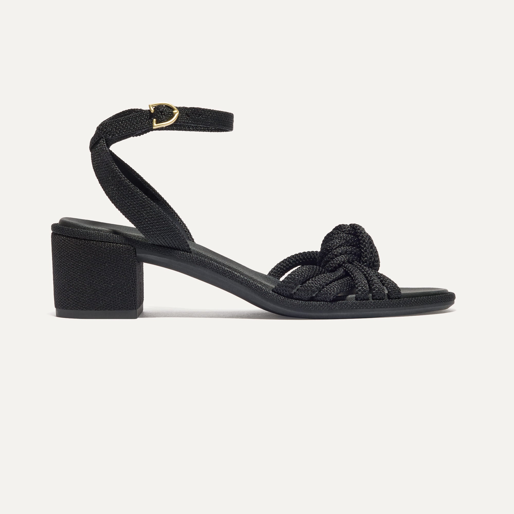 The Knot Sandal in Black shown from the side.