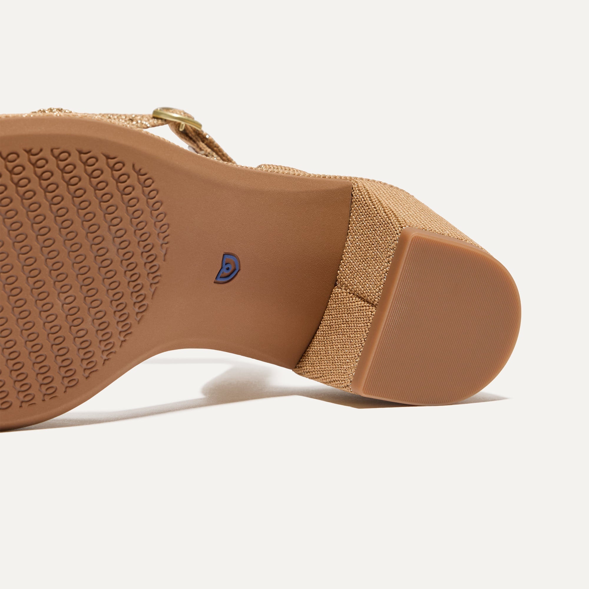 Close up of the outsoles of The Knot Sandal in Golden Sun.