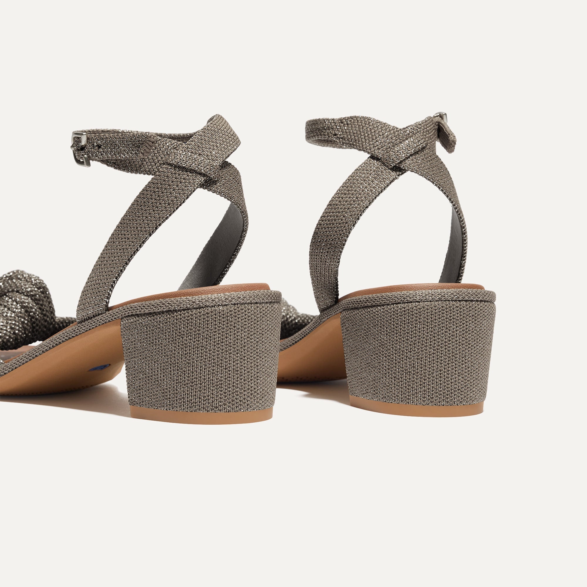 Close up of the heel of The Knot Sandal in Silver Sand.