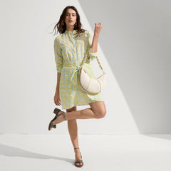 Alternate view of a model wearing The Knot Sandal in Silver Sand.