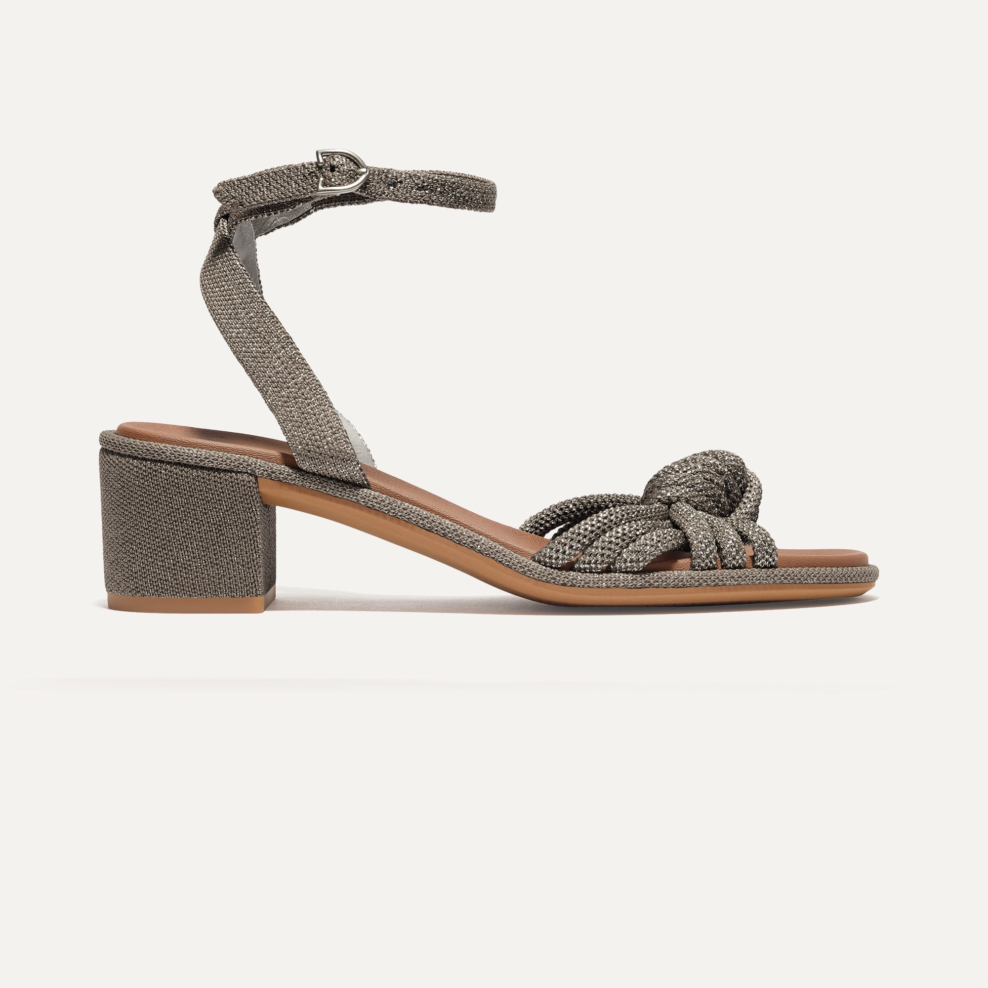 The Knot Sandal in Silver Sand shown from the side.