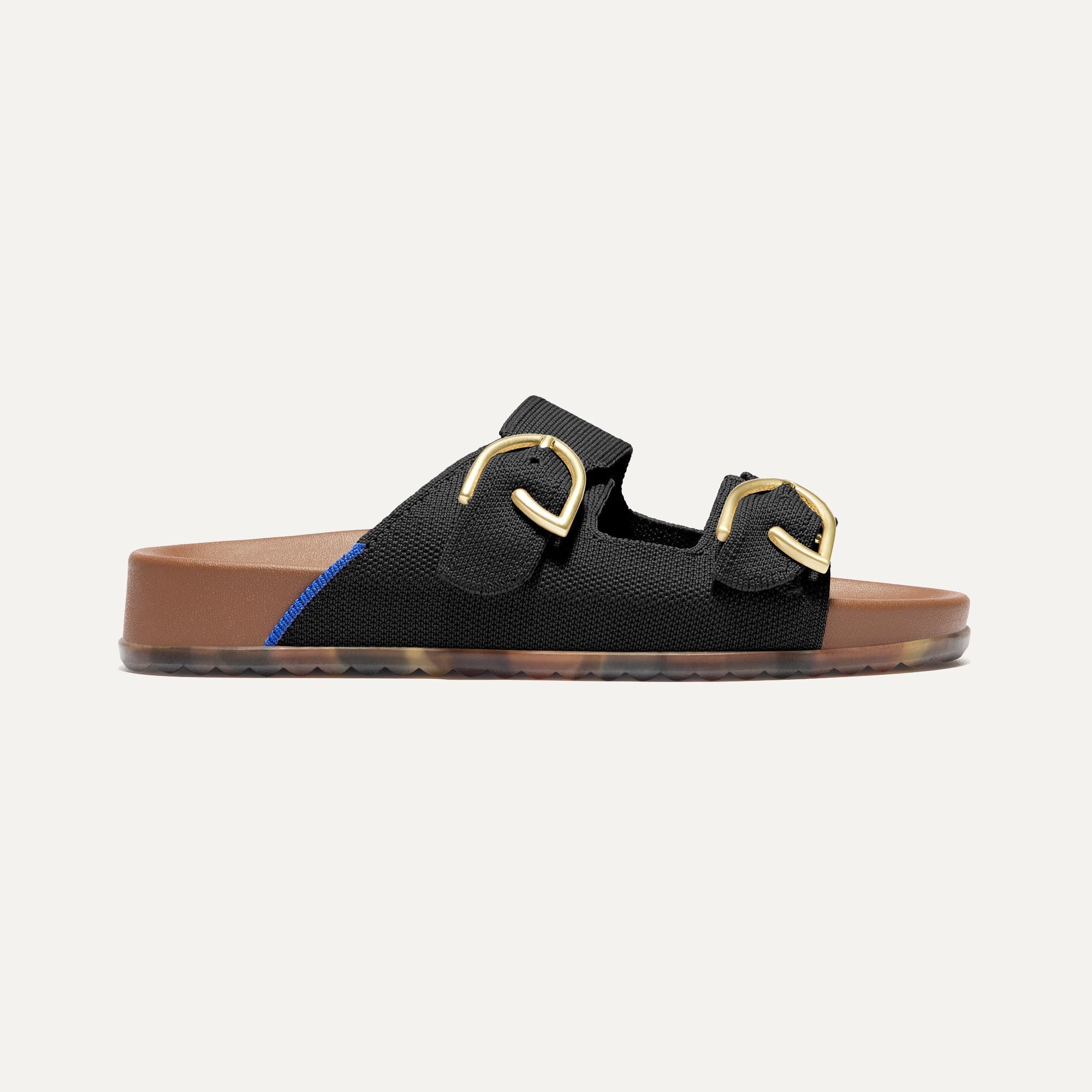 The Buckle Slide Sandal in Black shown from the side.