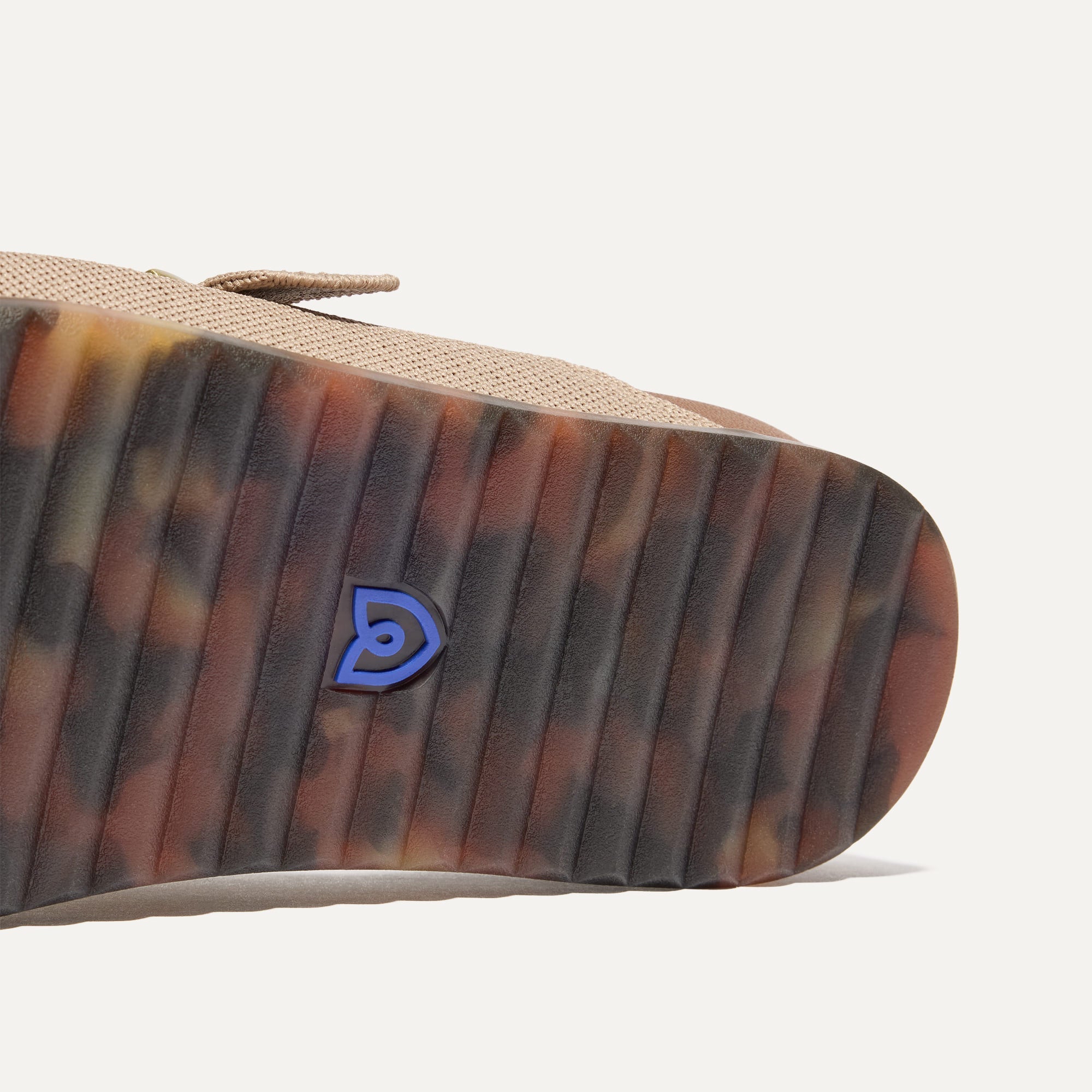 Close up of the outsole of The Buckle Slide Sandal in Dune.