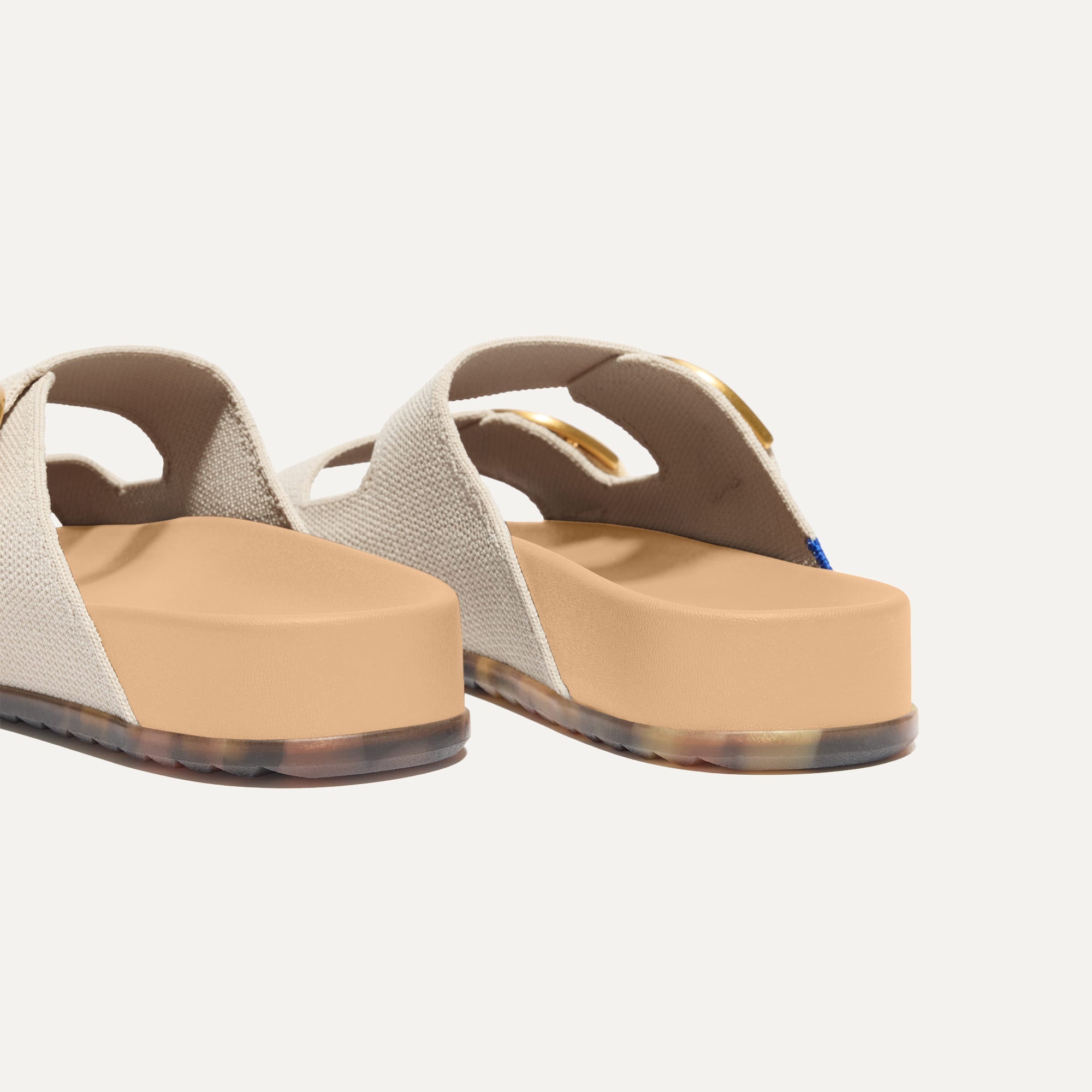 Close up of the heel of The Buckle Slide Sandal in Sea Salt.