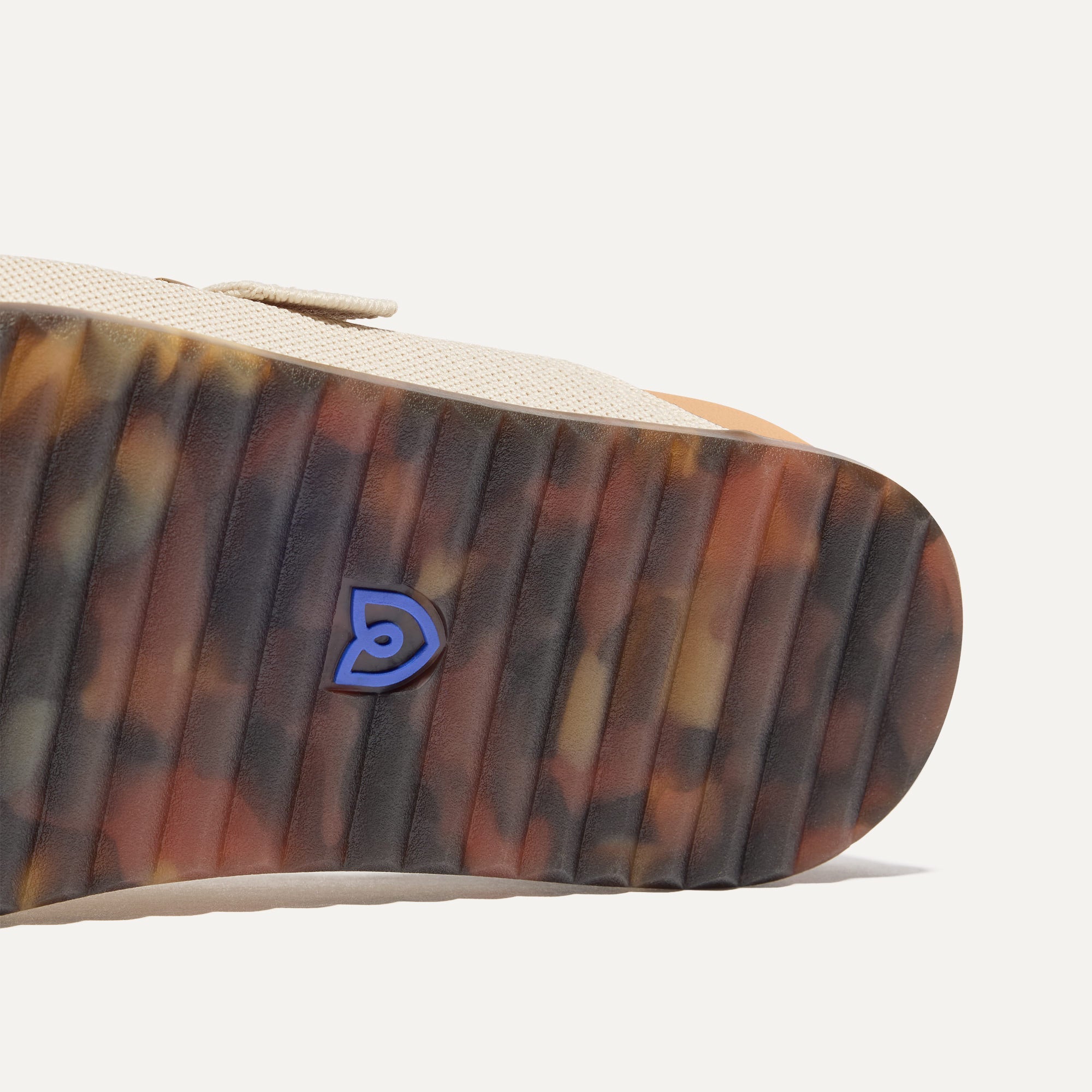 Close up of the outsole of The Buckle Slide Sandal in Sea Salt.