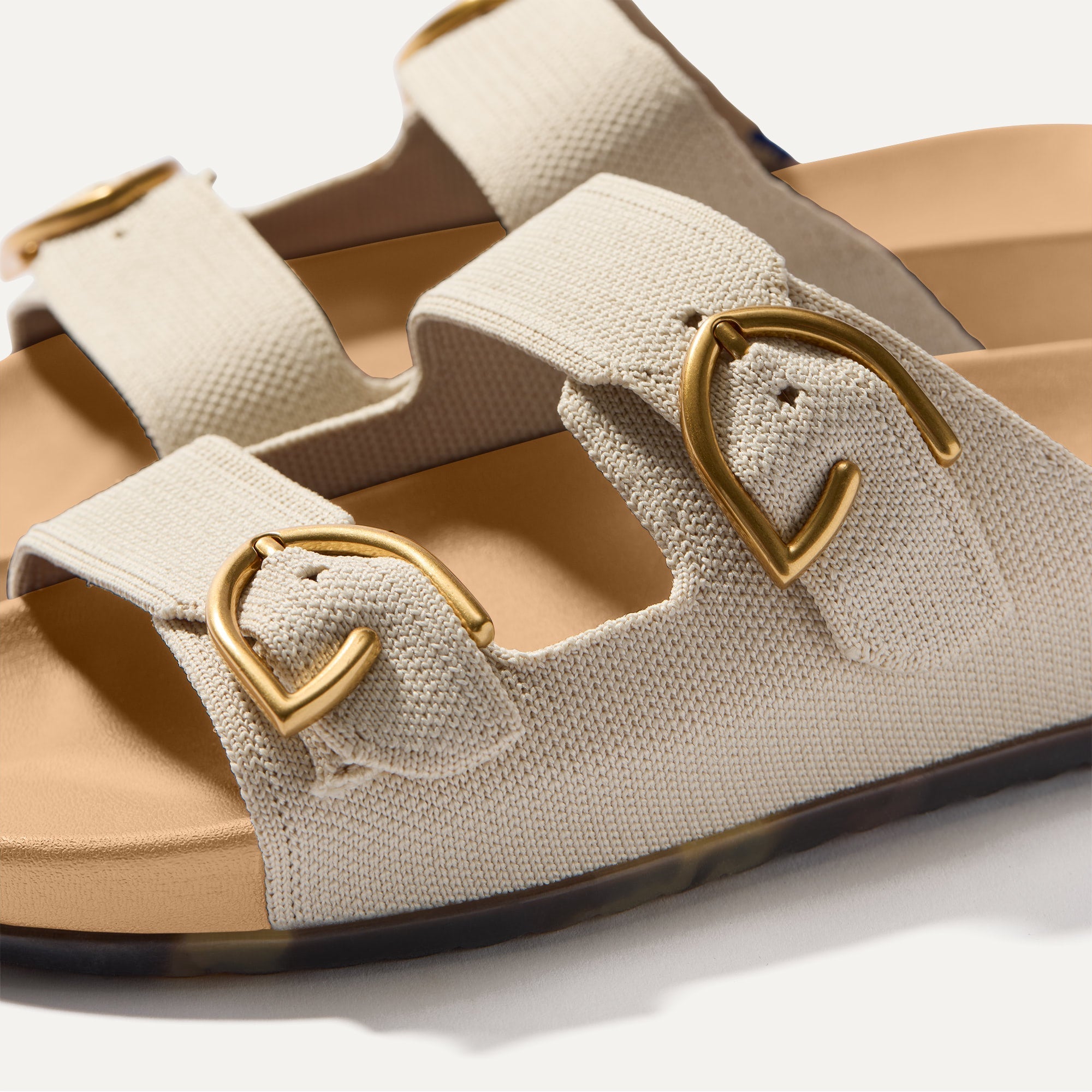 Close up of buckle closer of The Buckle Slide Sandal in Sea Salt.