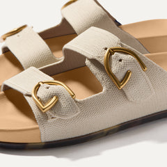 Close up of buckle closer of The Buckle Slide Sandal in Sea Salt.