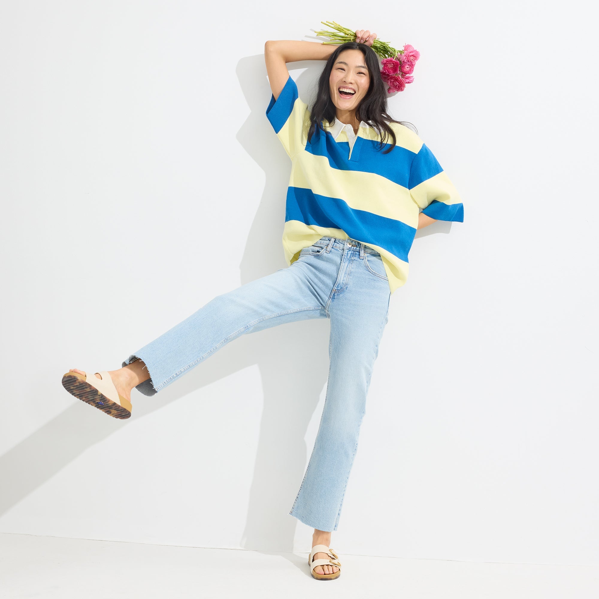 Model wearing The Buckle Slide Sandal in Sea Salt