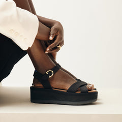 hover | Model wearing The Criss-Cross Lightweight Wedge Sandal in Black.