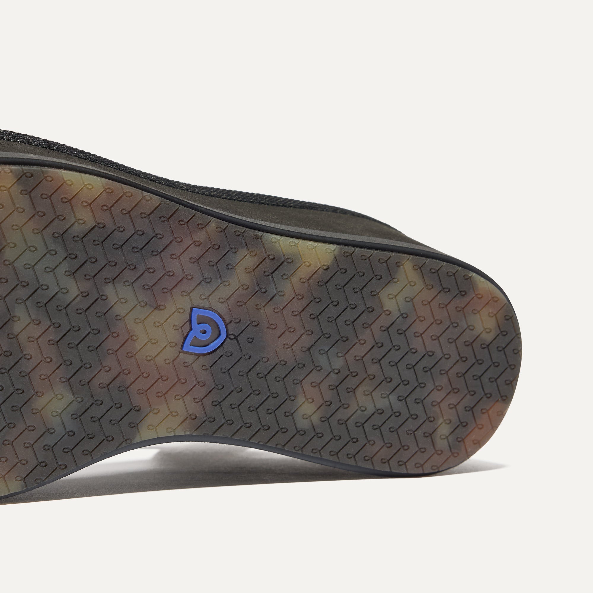 Close up of the outsole of The Criss-Cross Lightweight Wedge Sandal in Black.