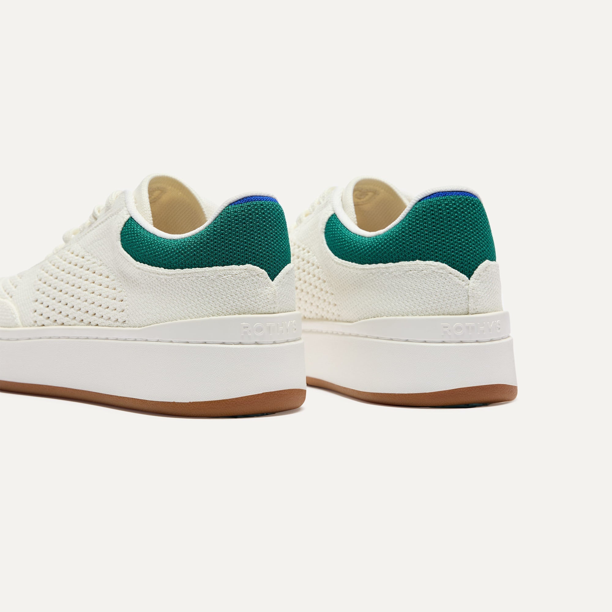 Close up of the heel of The Court Sneaker in Birdie, with Rothy's signature blue halo. 