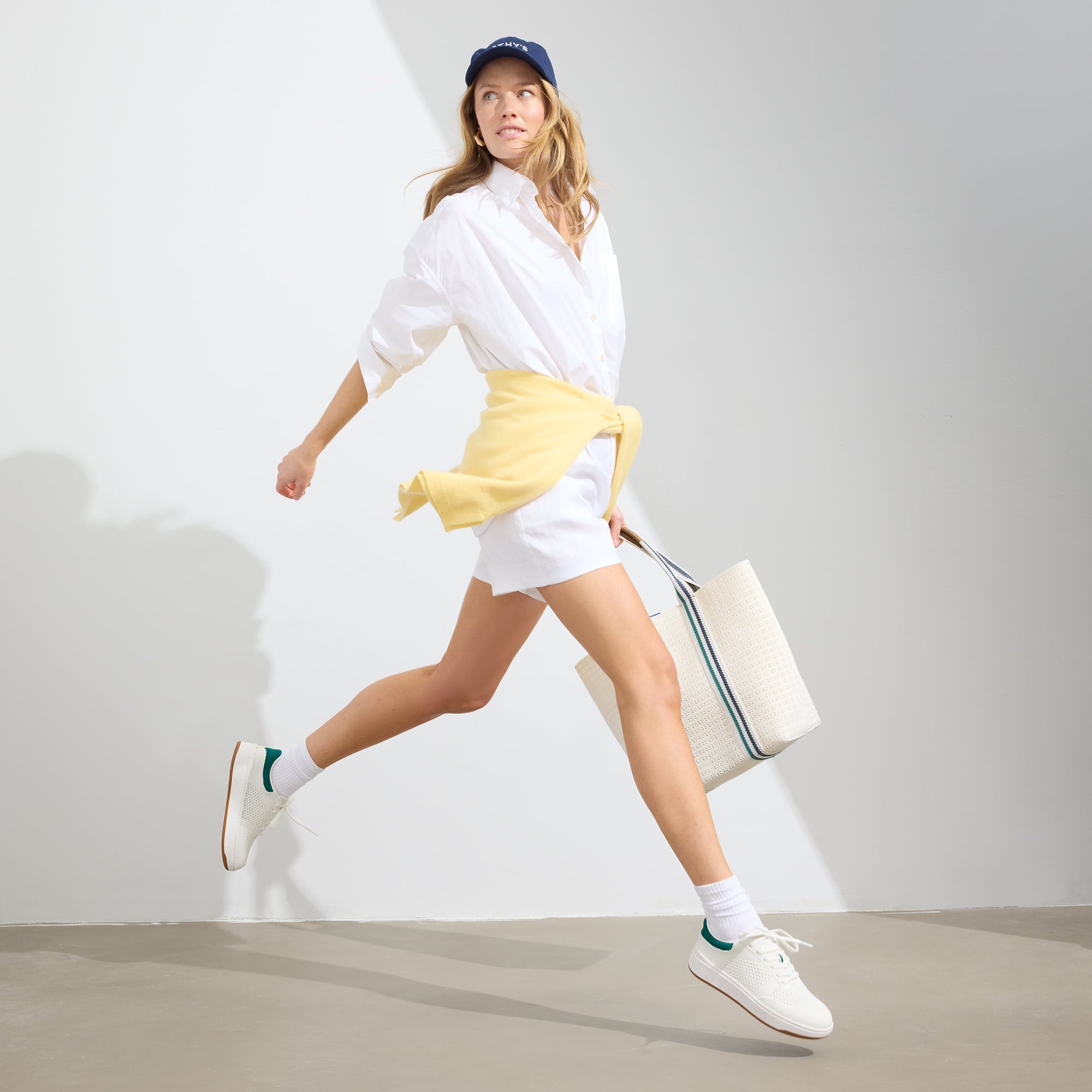 Alternate view of a model wearing The Court Sneaker in Birdie.