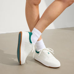 hover | Model wearing The Court Sneaker in Birdie.