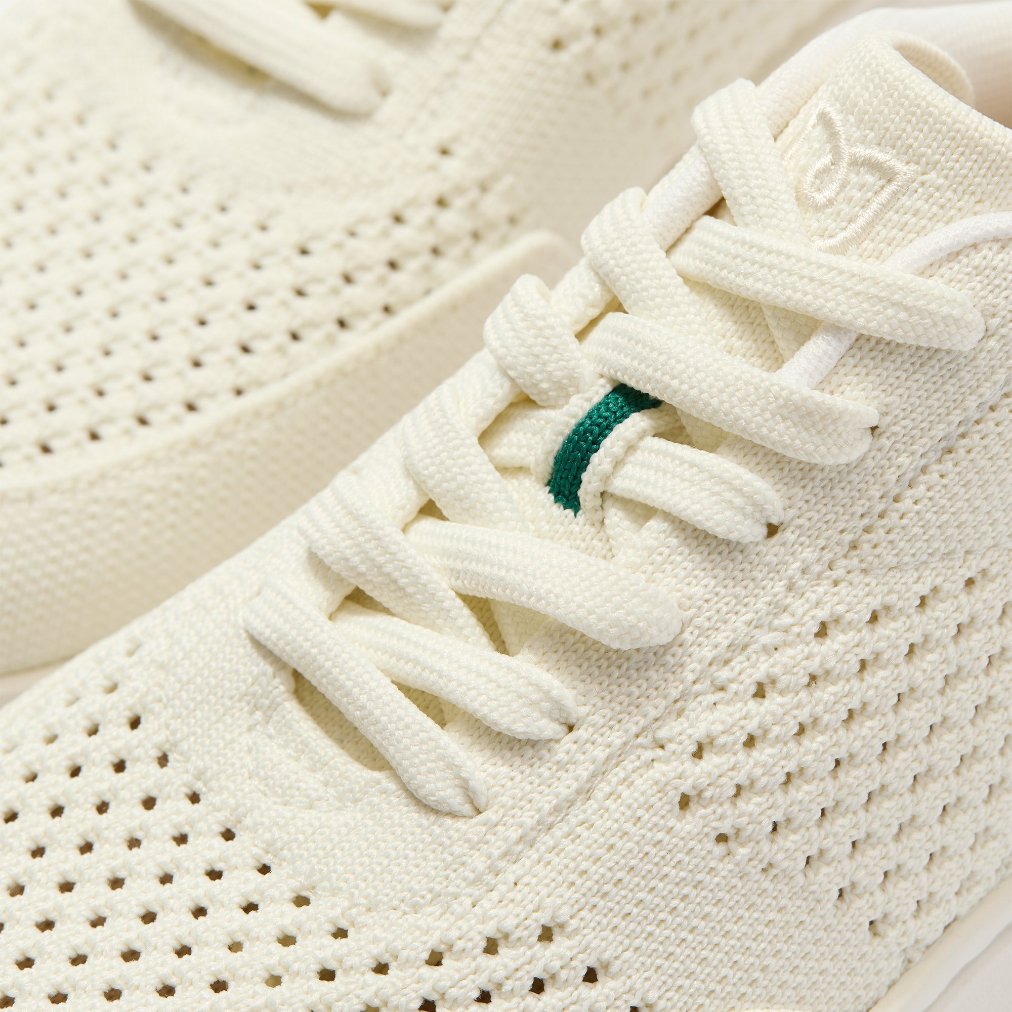 Close up of the laces of The Court Sneaker in Birdie.