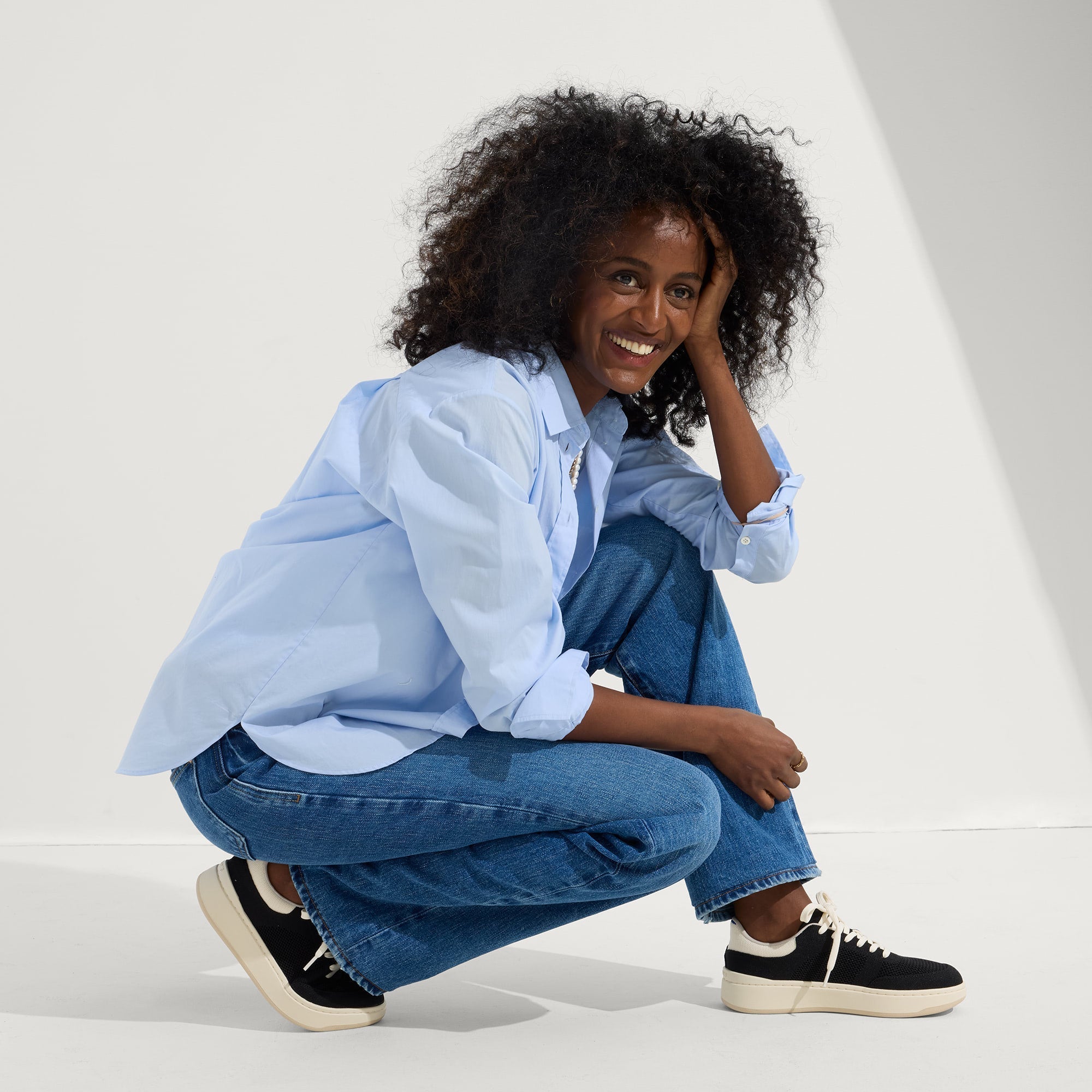 Alternate view of a model wearing The Court Sneaker in Black.