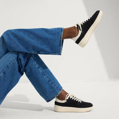 hover | Model wearing The Court Sneaker in Black.