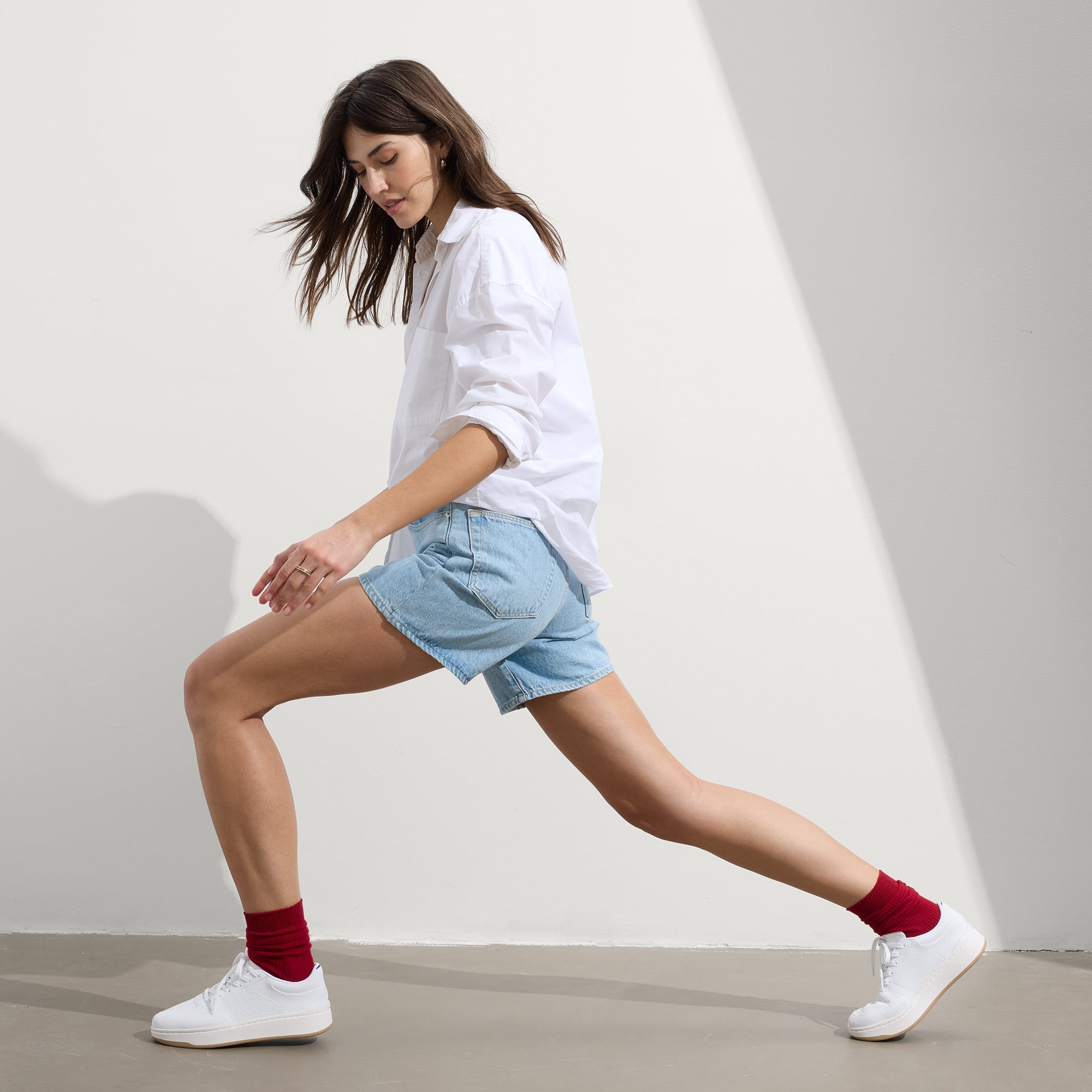 Alternate view of a model wearing The Court Sneaker in Bright White.
