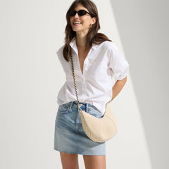 The Crossbody Strap in Black Chain, shown paired with The Crescent Bag.