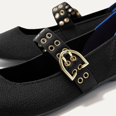 Close up of the buckle hardware and grommets on the straps of The Ballet Mary Jane in Black.
