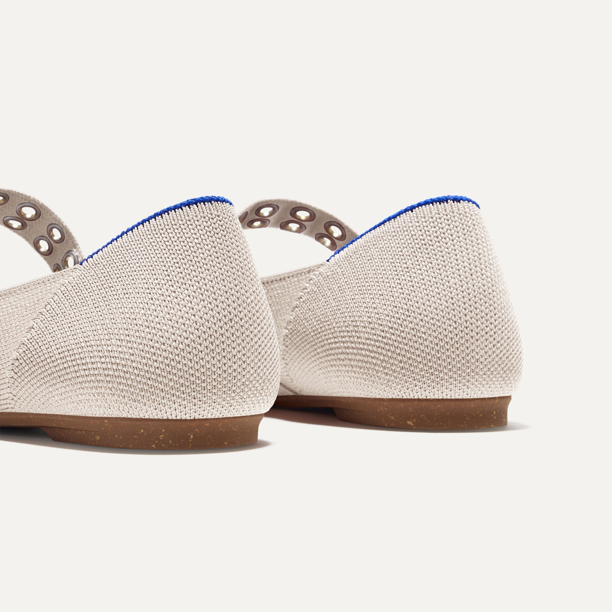 Close up of The heel of The Ballet Mary Jane in Conch with Rothy's signature blue halo.