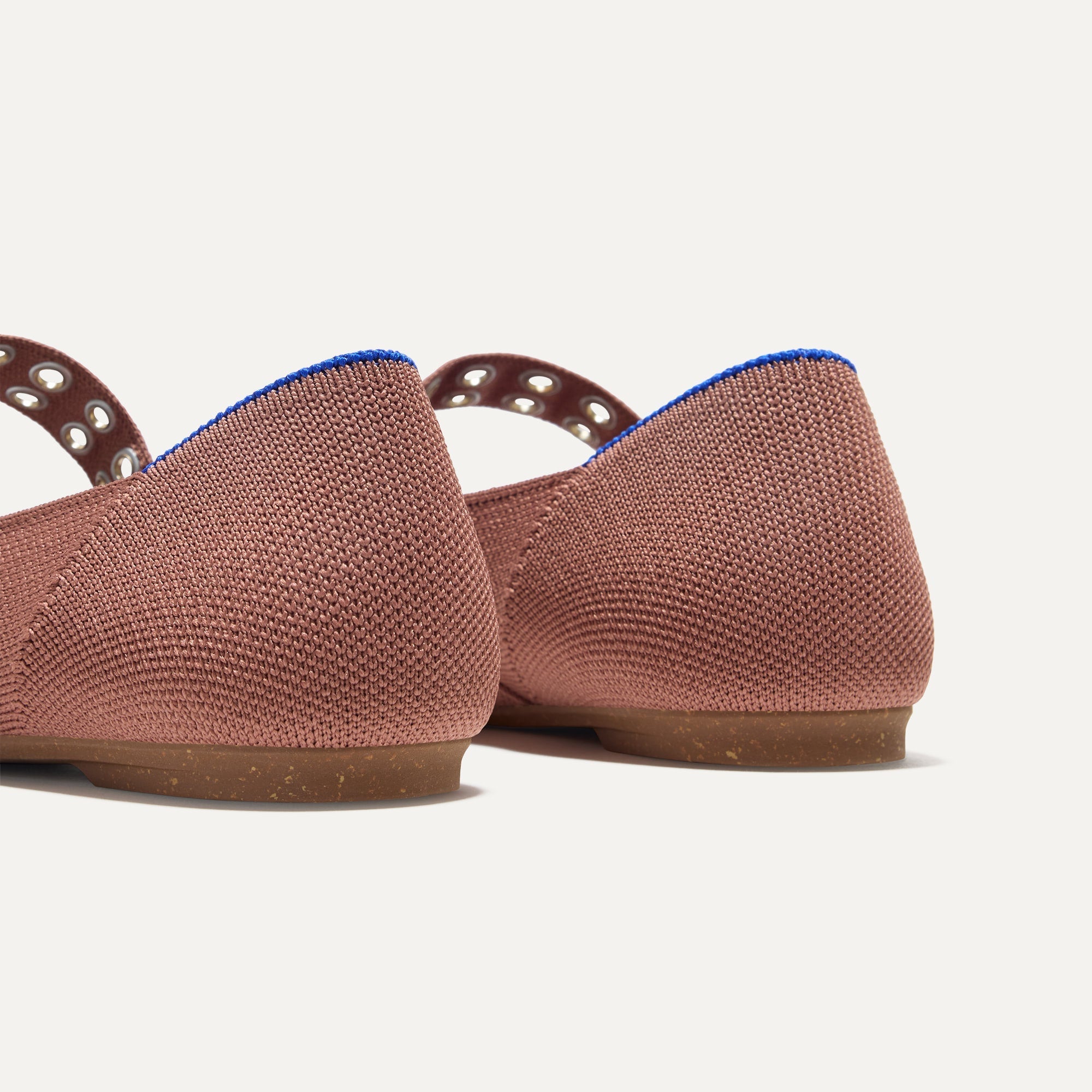 Close up of The heel of The Ballet Mary Jane in Hazel with Rothy's signature blue halo.