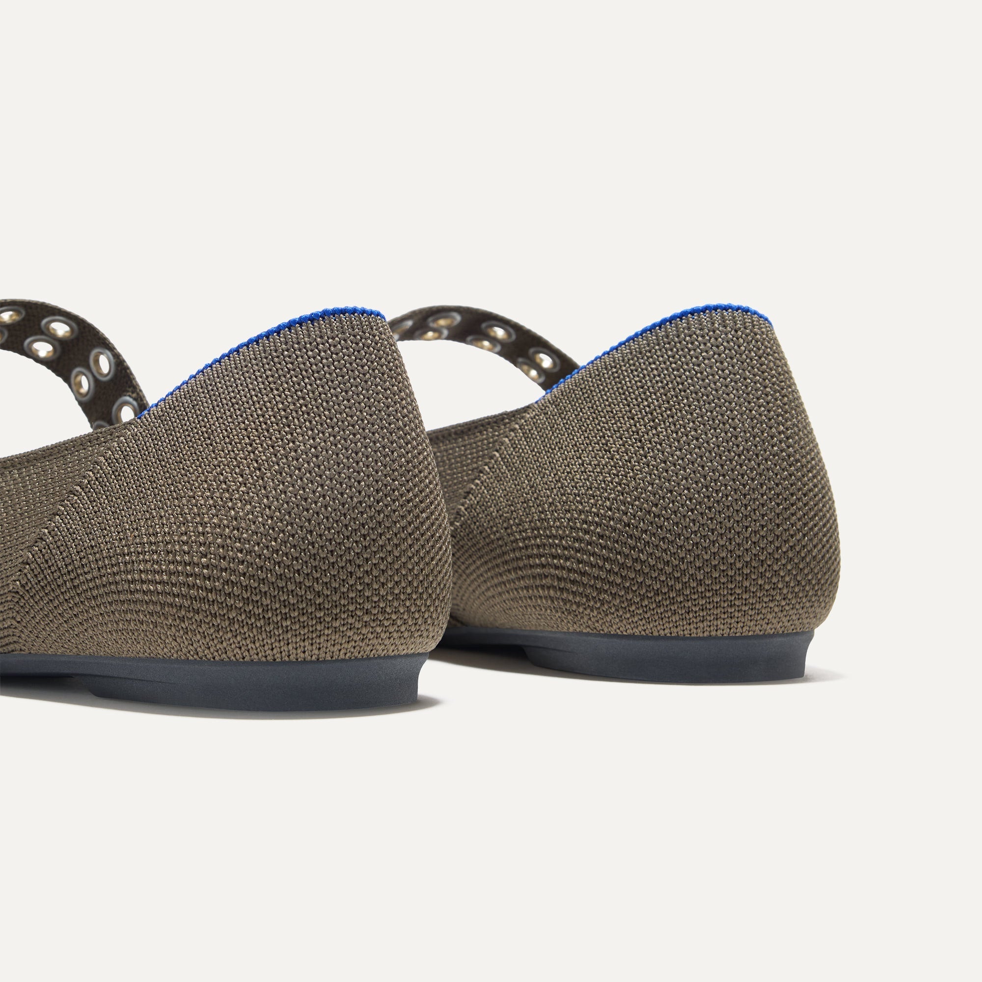 Close up of The heel of The Ballet Mary Jane in Safari with Rothy's signature blue halo.