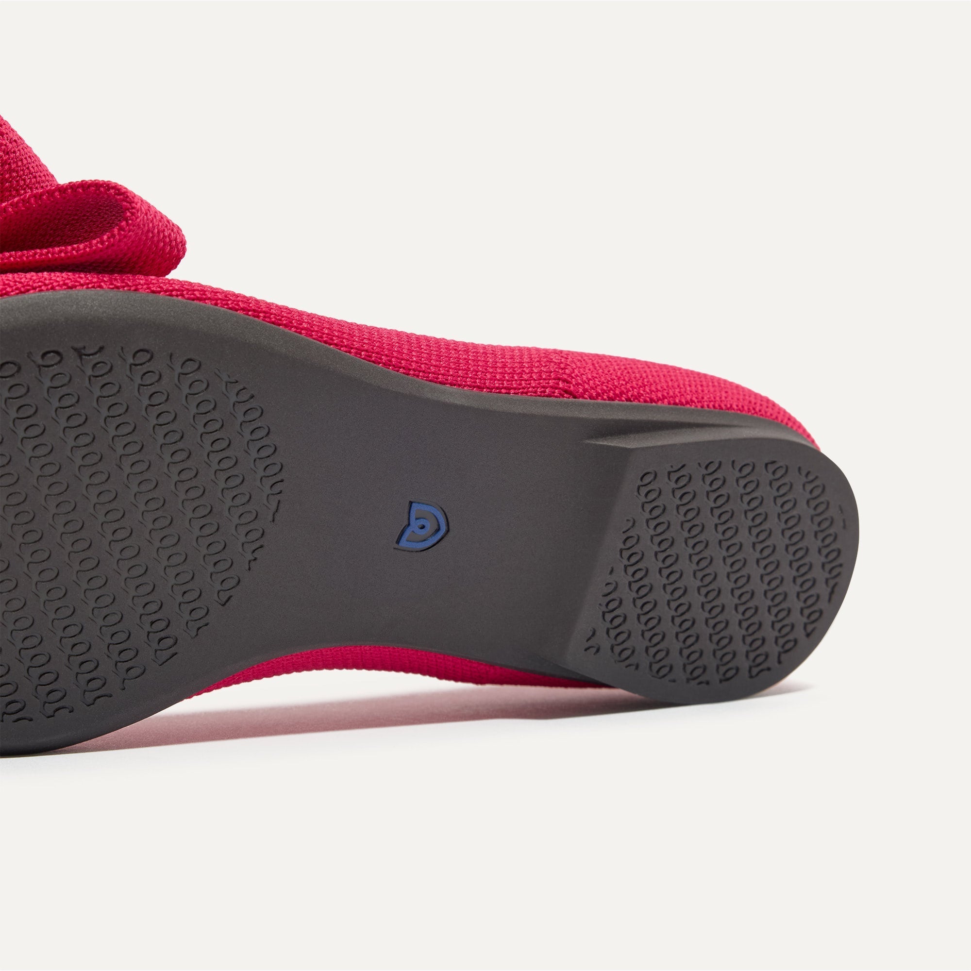 The sole of The Bow Point II in Rouge shown in diagonal view.