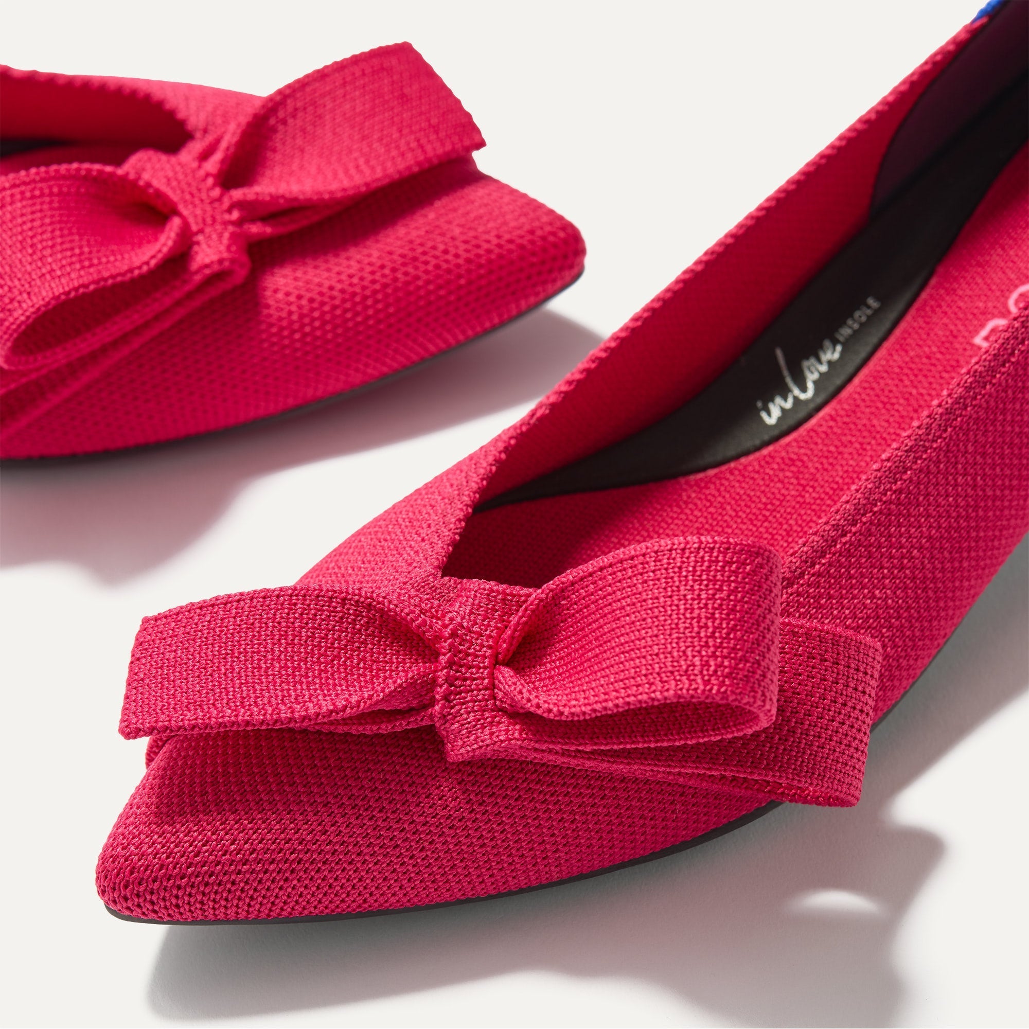 Close up of The Bow Point II in Rouge, shown in diagonal view. 