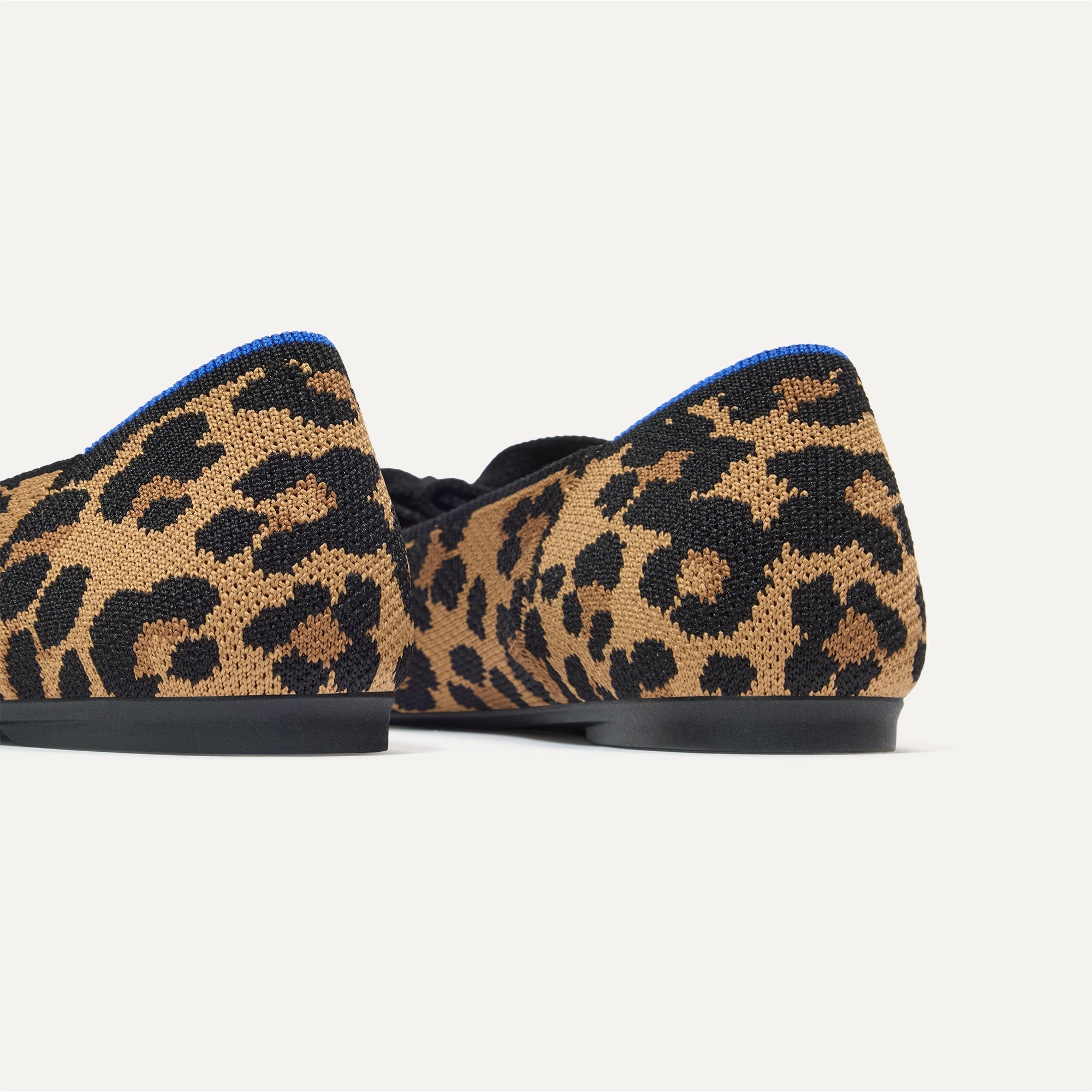 Close up of the heel of The Bow Point II in Sable Spot, with Rothy's signature blue halo.