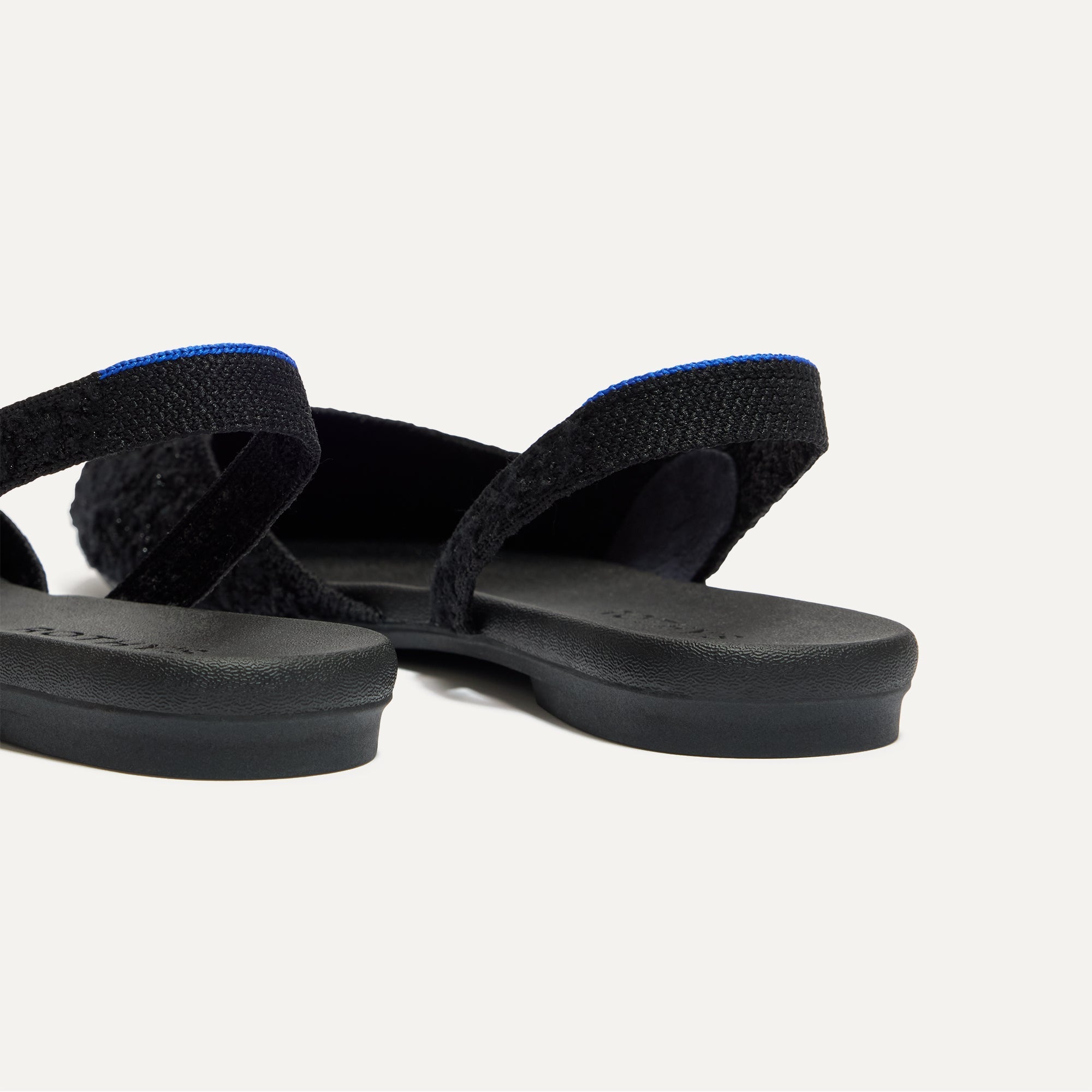 Close up of the heel The Almond Slingback in Black Bouclé.