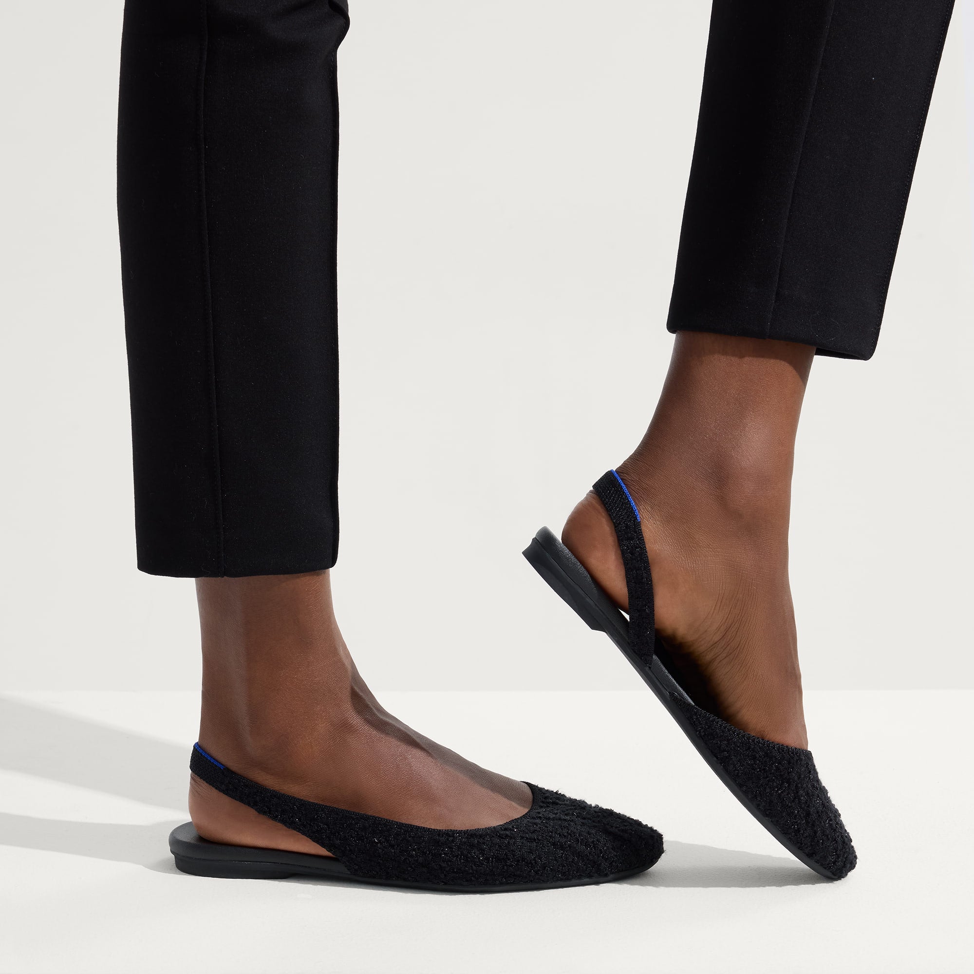 hover | Model wearing The Almond Slingback in Black Bouclé.