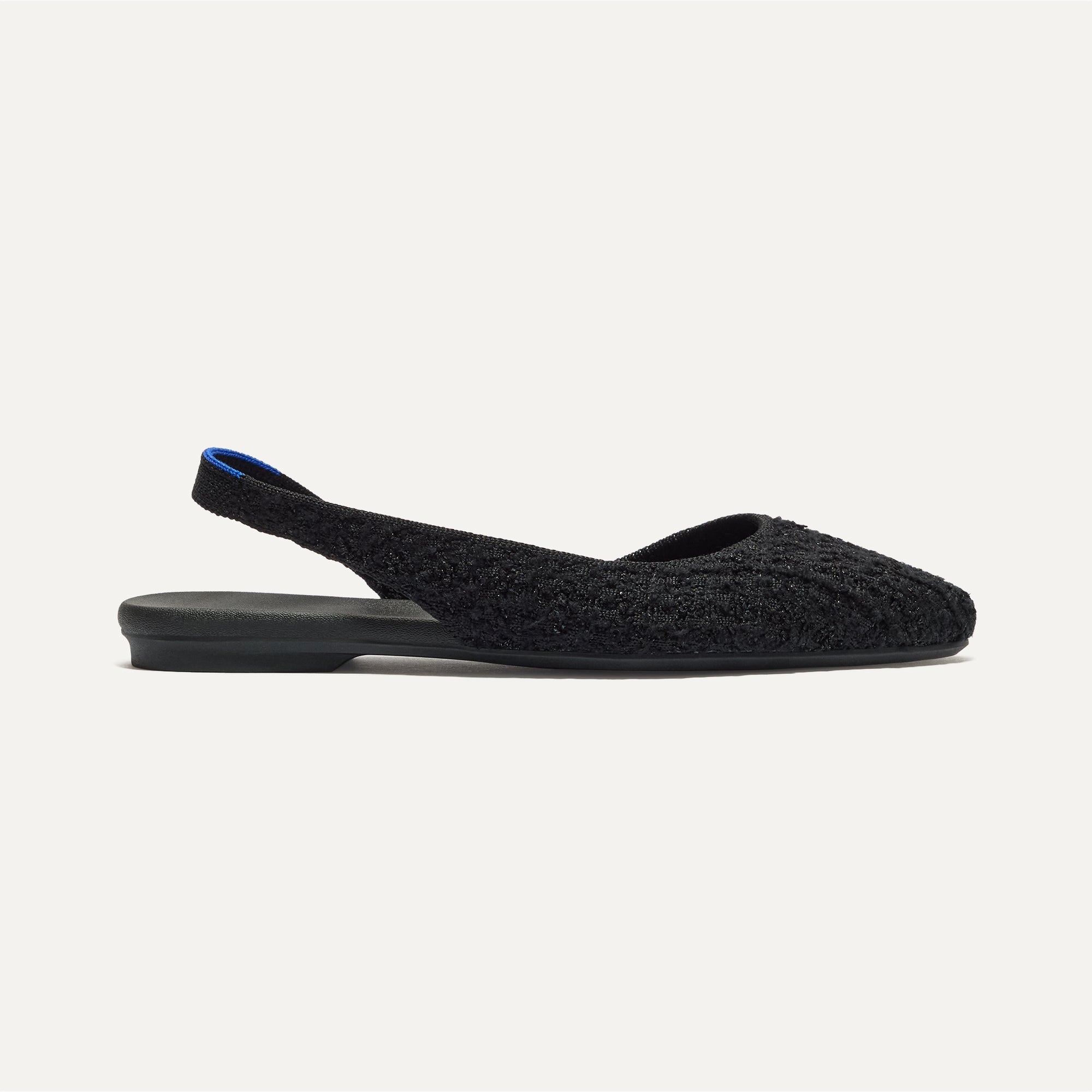 Side view of The Almond Slingback in Black Bouclé.