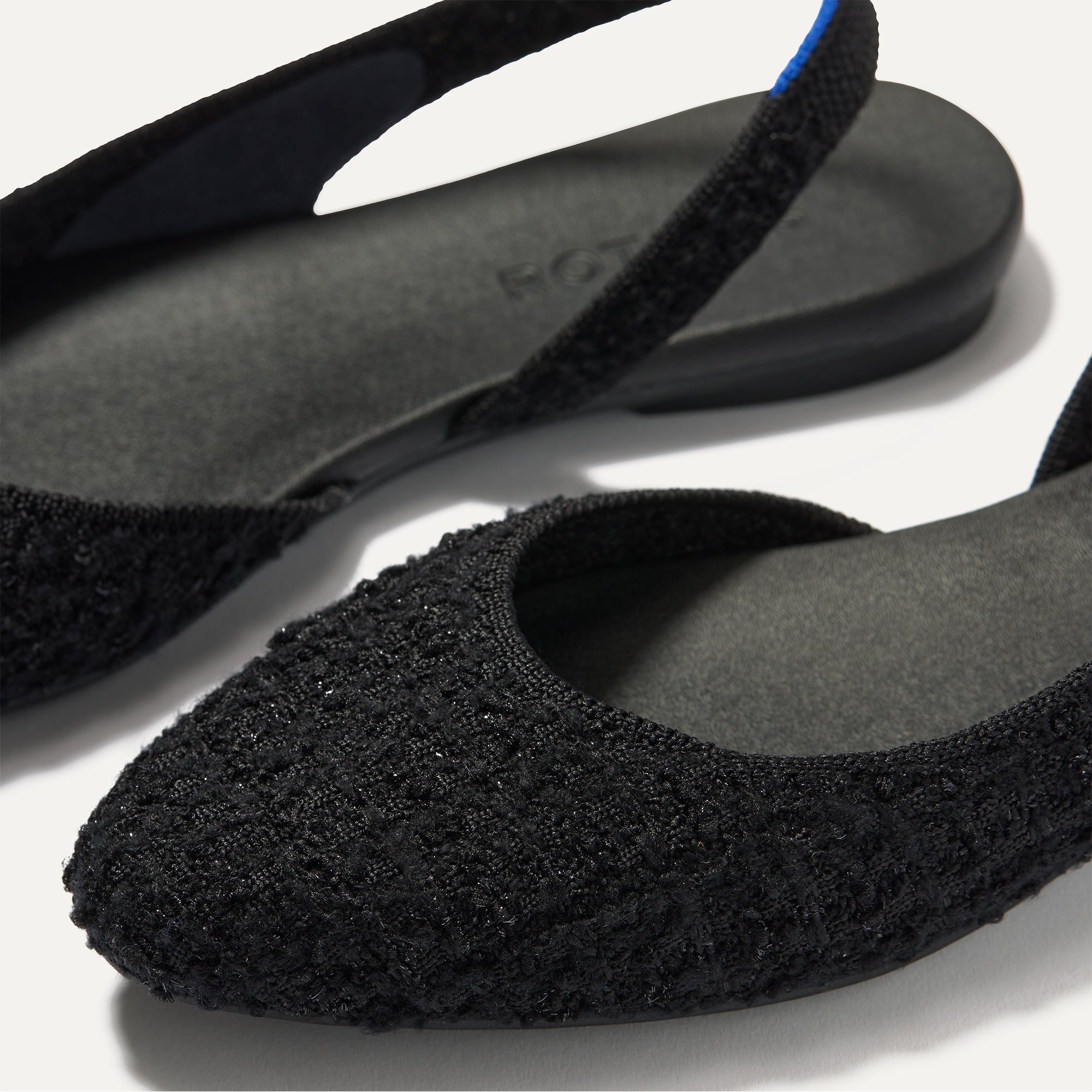 Close up of the toe and vamp on The Almond Slingback in Black Bouclé.