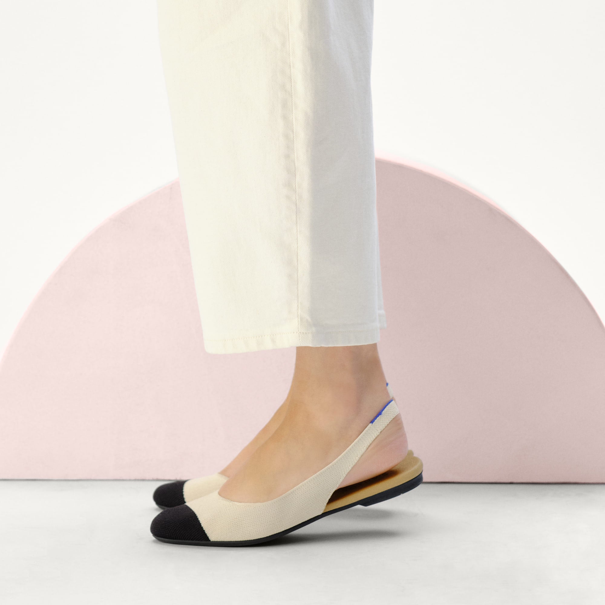 hover | Model wearing The Almond Slingback in Conch Captoe.