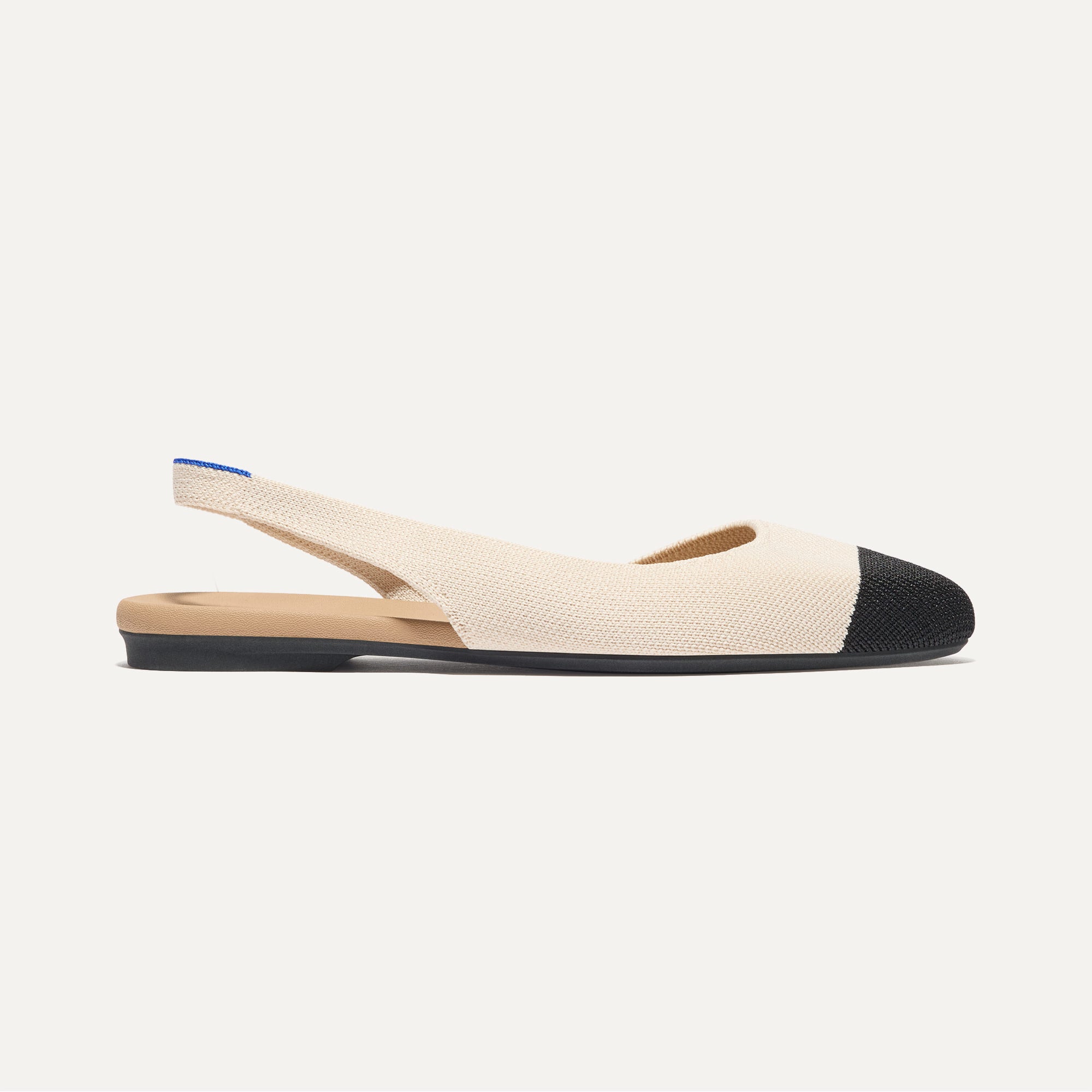 Side view of The Almond Slingback in Conch Captoe.