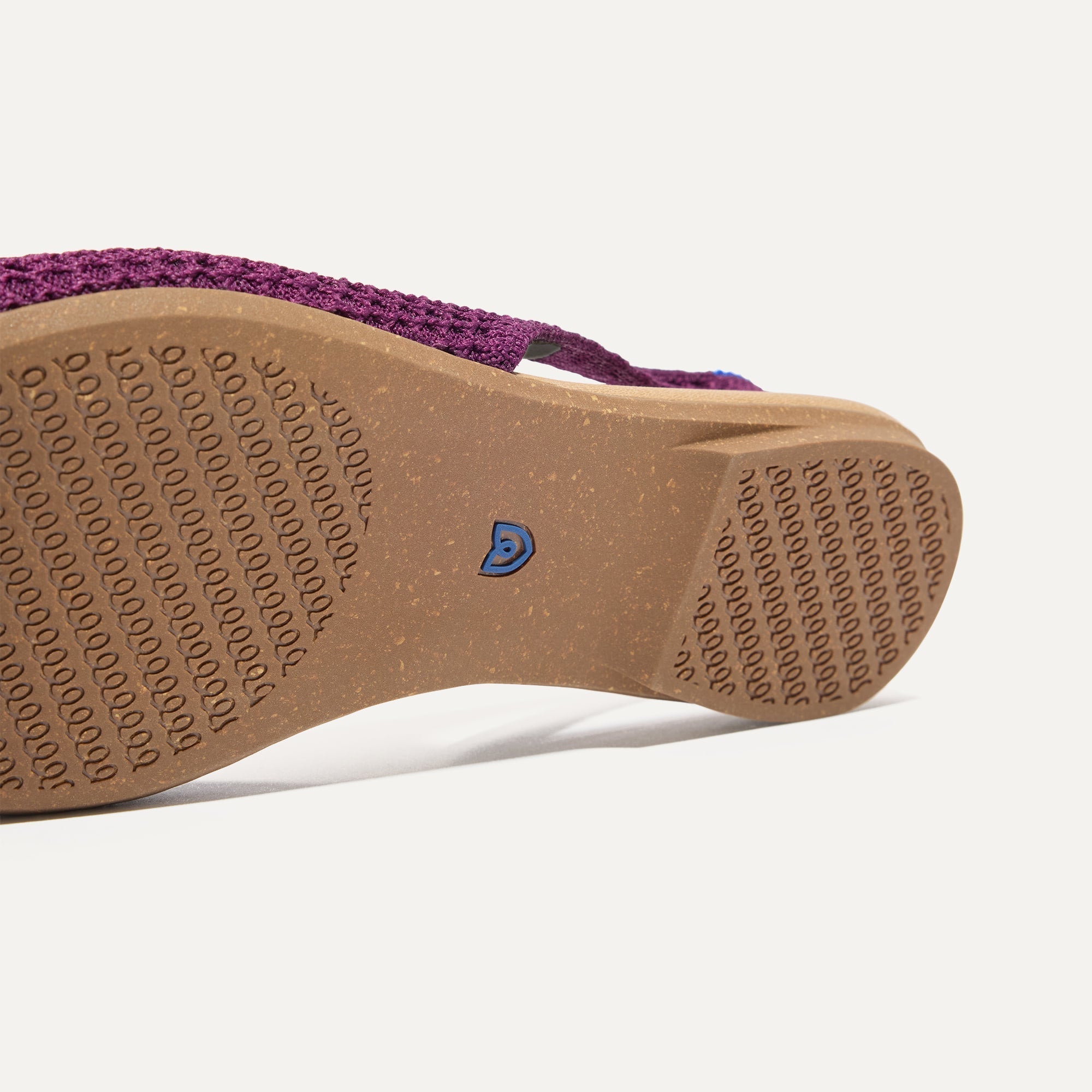 Close up of the outsole of The Almond Slingback in Plum Mesh.