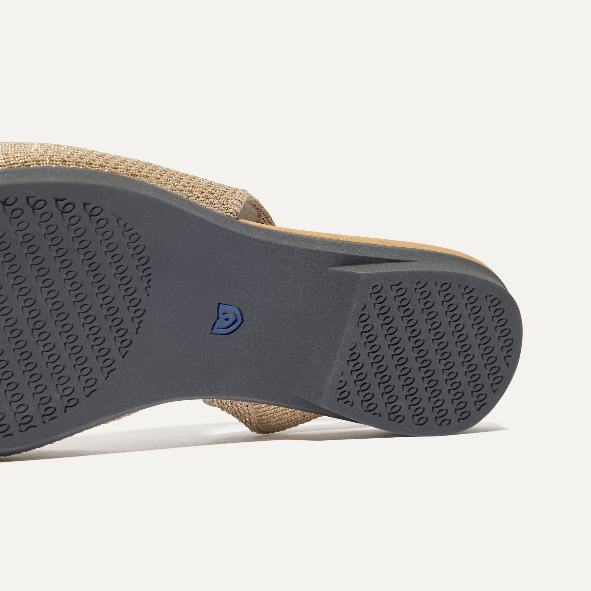 Close up of the outsole of The Almond Slingback in Metallic Prosecco.