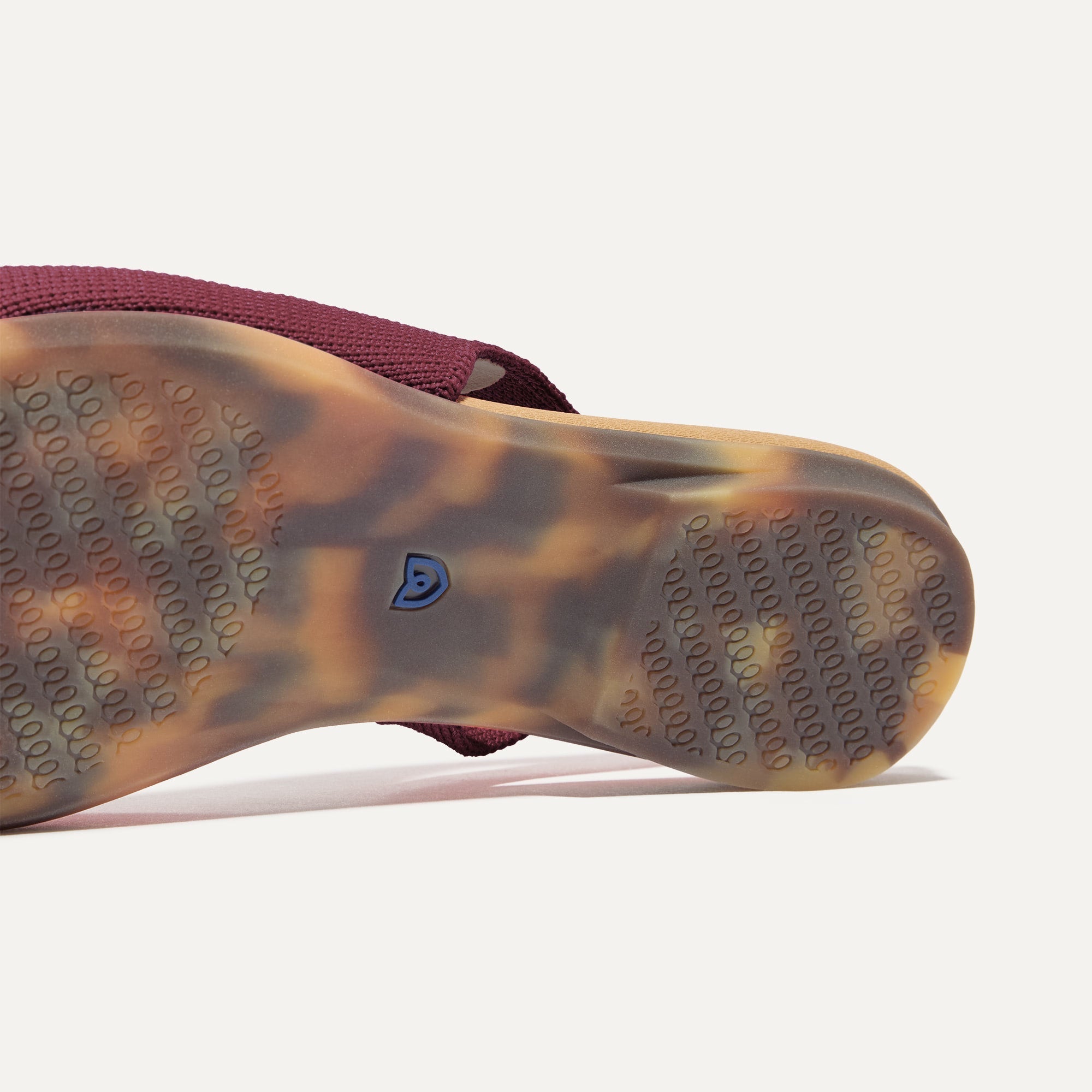 Close up of the outsole of The Almond Slingback in Syrah.