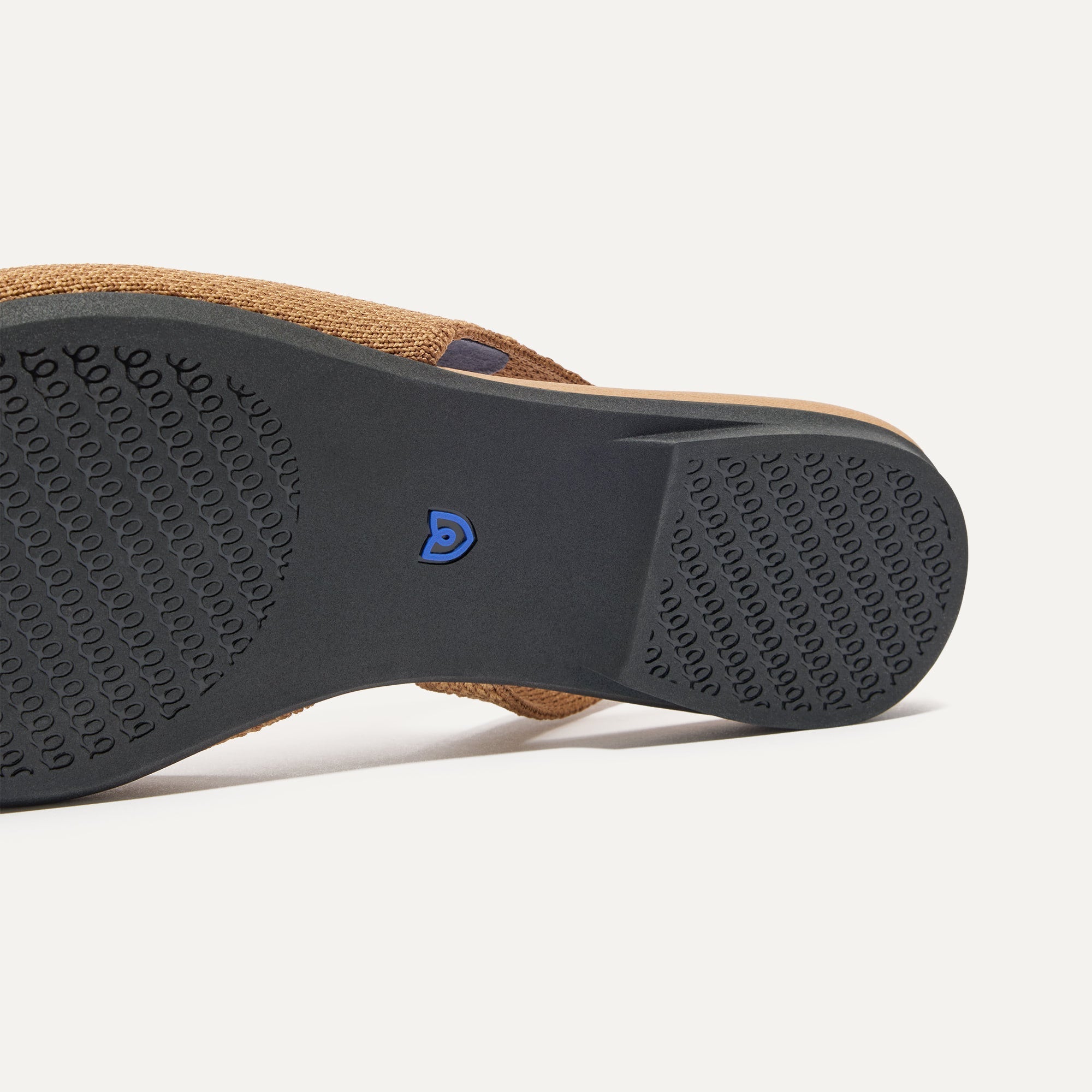 Close up of the outsole of The Almond Slingback in Tawny Captoe.