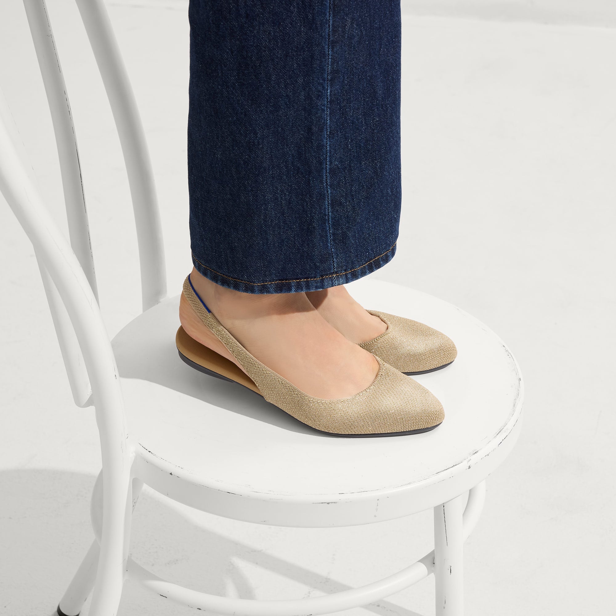 hover | Model wearing The Almond Slingback in Metallic Prosecco.