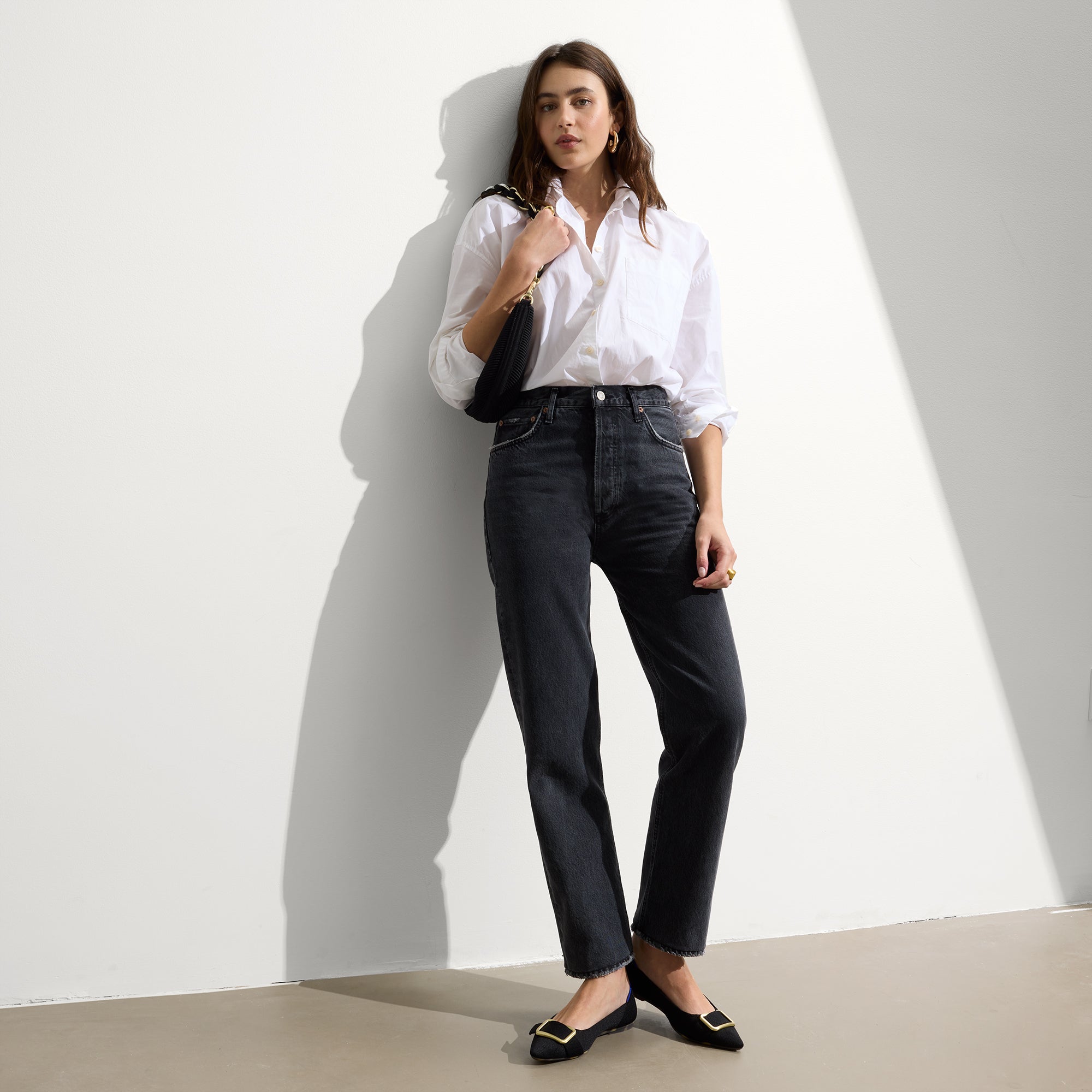 Alternate view of a model wearing The Emblem Point II in Black.