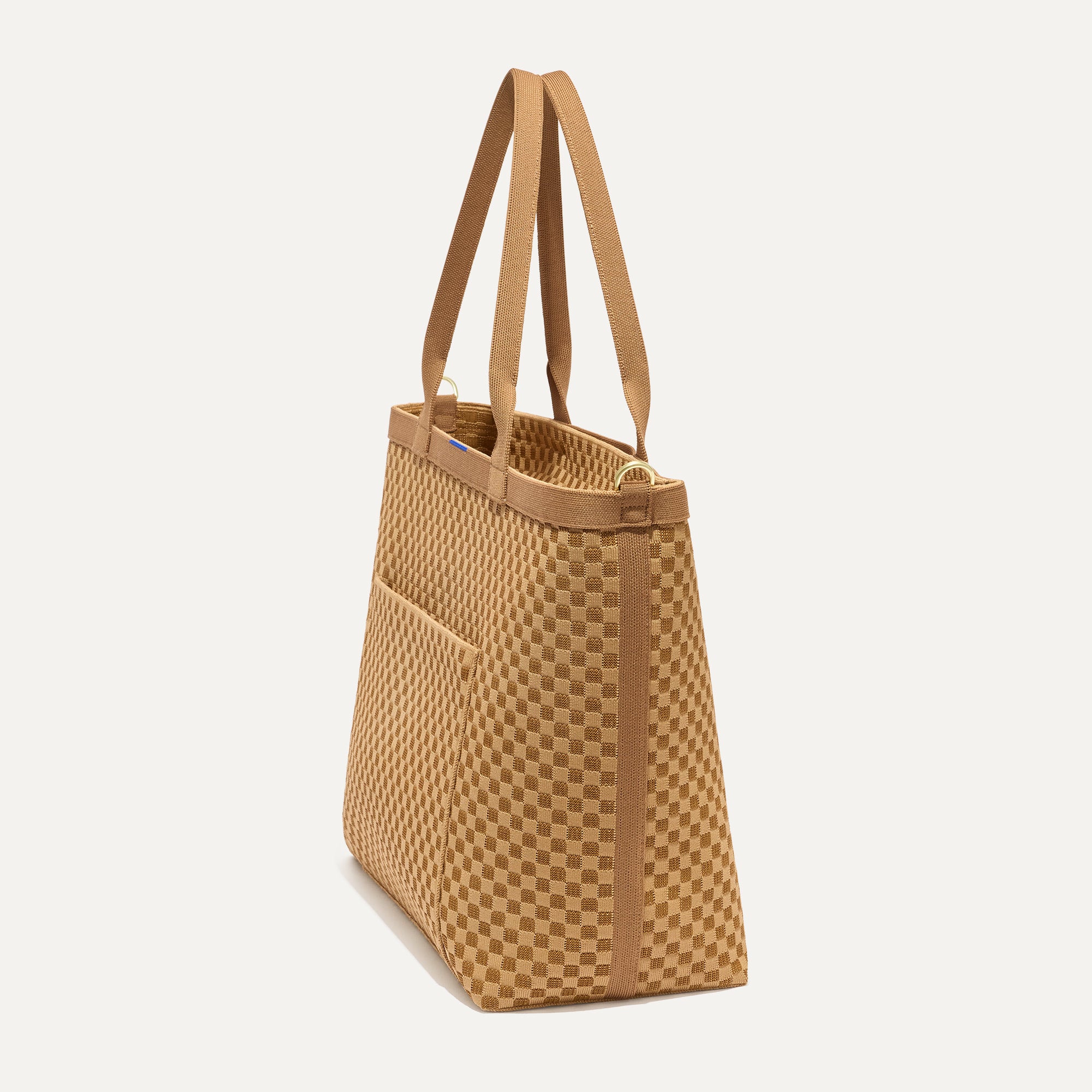 The Zip Travel Tote in Hazelnut shown from the side.